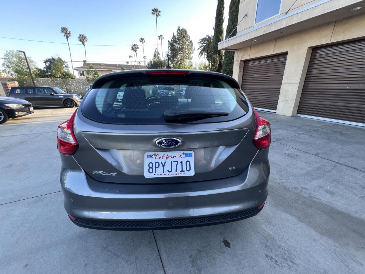 2014 Gray /Balck Ford Focus SE Hatch (1FADP3K21EL) with an 2.0L L4 DOHC 16V engine, Automatic transmission, located at 30 S. Berkeley Avenue, Pasadena, CA, 91107, (626) 248-7567, 34.145447, -118.109398 - Microsoft Sync! Moon-roof! This 2014 Ford Focus SE Hatch looks and drives good. Bad credit? We can help! We are the bank. - Photo#12