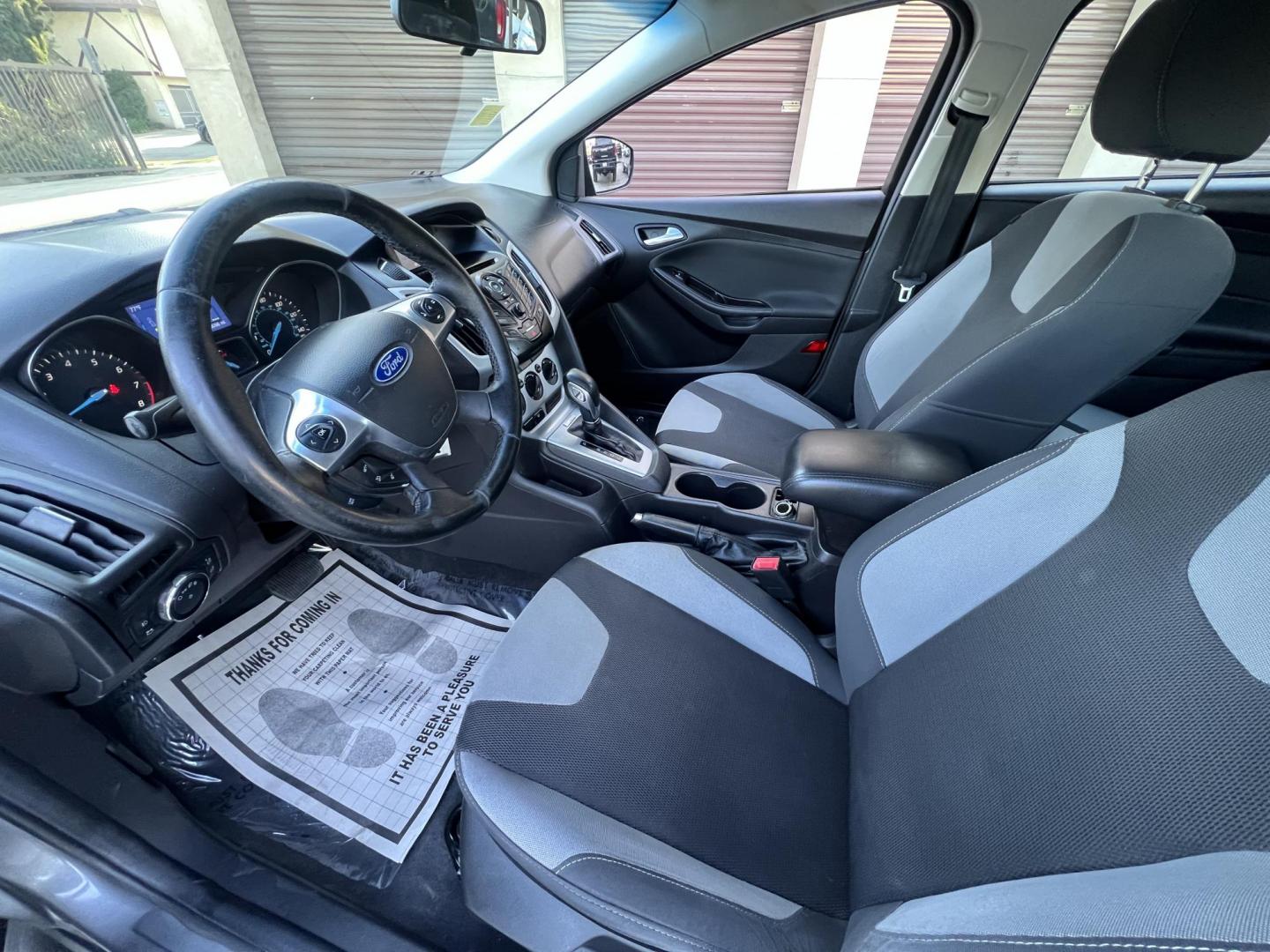 2014 Gray /Balck Ford Focus SE Hatch (1FADP3K21EL) with an 2.0L L4 DOHC 16V engine, Automatic transmission, located at 30 S. Berkeley Avenue, Pasadena, CA, 91107, (626) 248-7567, 34.145447, -118.109398 - Microsoft Sync! Moon-roof! This 2014 Ford Focus SE Hatch looks and drives good. Bad credit? We can help! We are the bank. - Photo#19