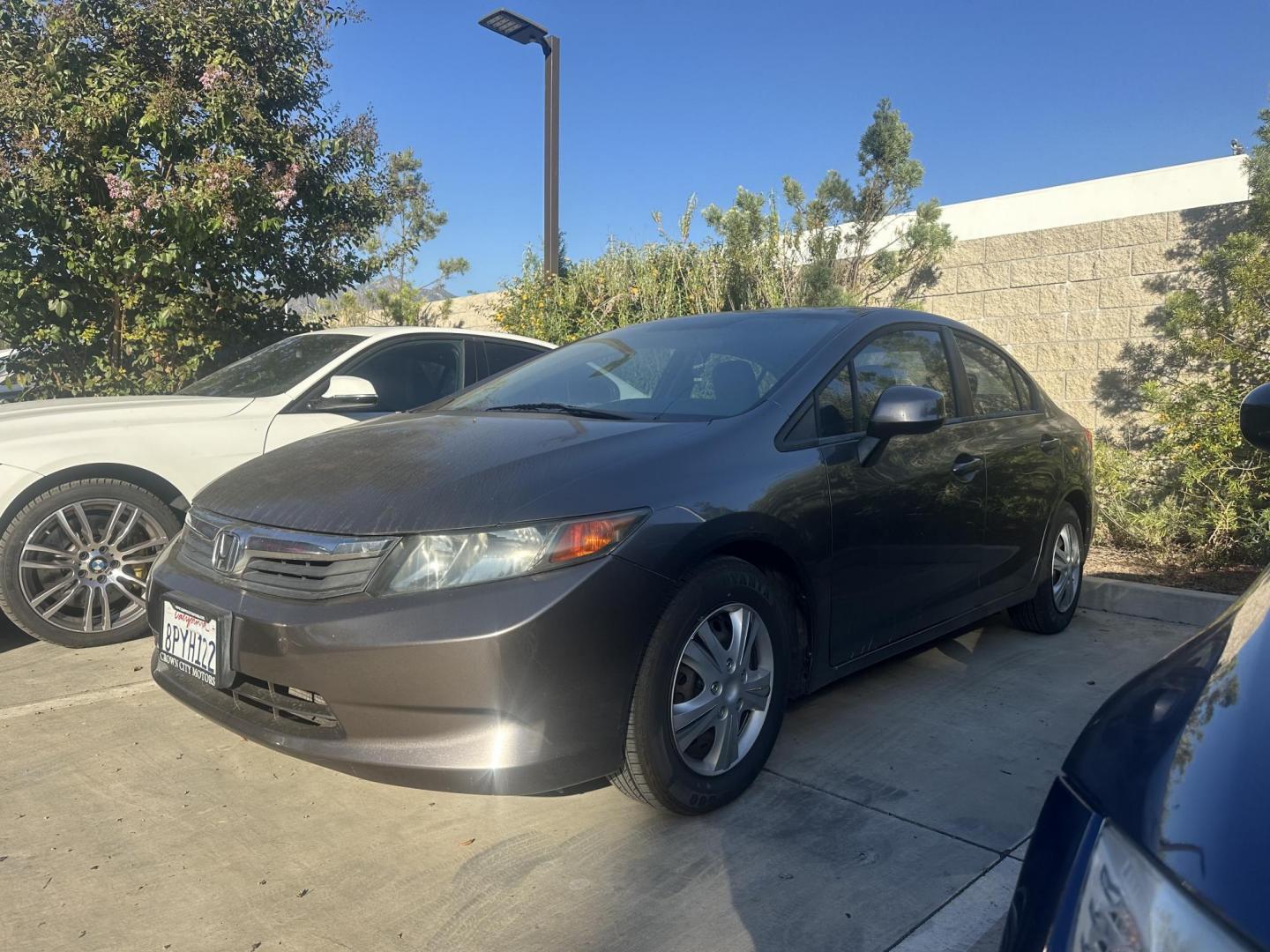 2012 Urban Titanium Metallic /Tan Honda Civic LX Sedan 5-Speed AT (19XFB2F59CE) with an 1.8L L4 SOHC 16V engine, 5-Speed Automatic transmission, located at 30 S. Berkeley Avenue, Pasadena, CA, 91107, (626) 248-7567, 34.145447, -118.109398 - This 2012 Honda Civic LX Sedan automatic looks and drives good. Bad credit, we can help. We are the bank. This Honda Civic LX comes with the following : Options A-C Adjustable Steering Wheel AM-FM Stereo Auxiliary Audio Input Brake Assist Bucket Seats CD Player Child Safet - Photo#1