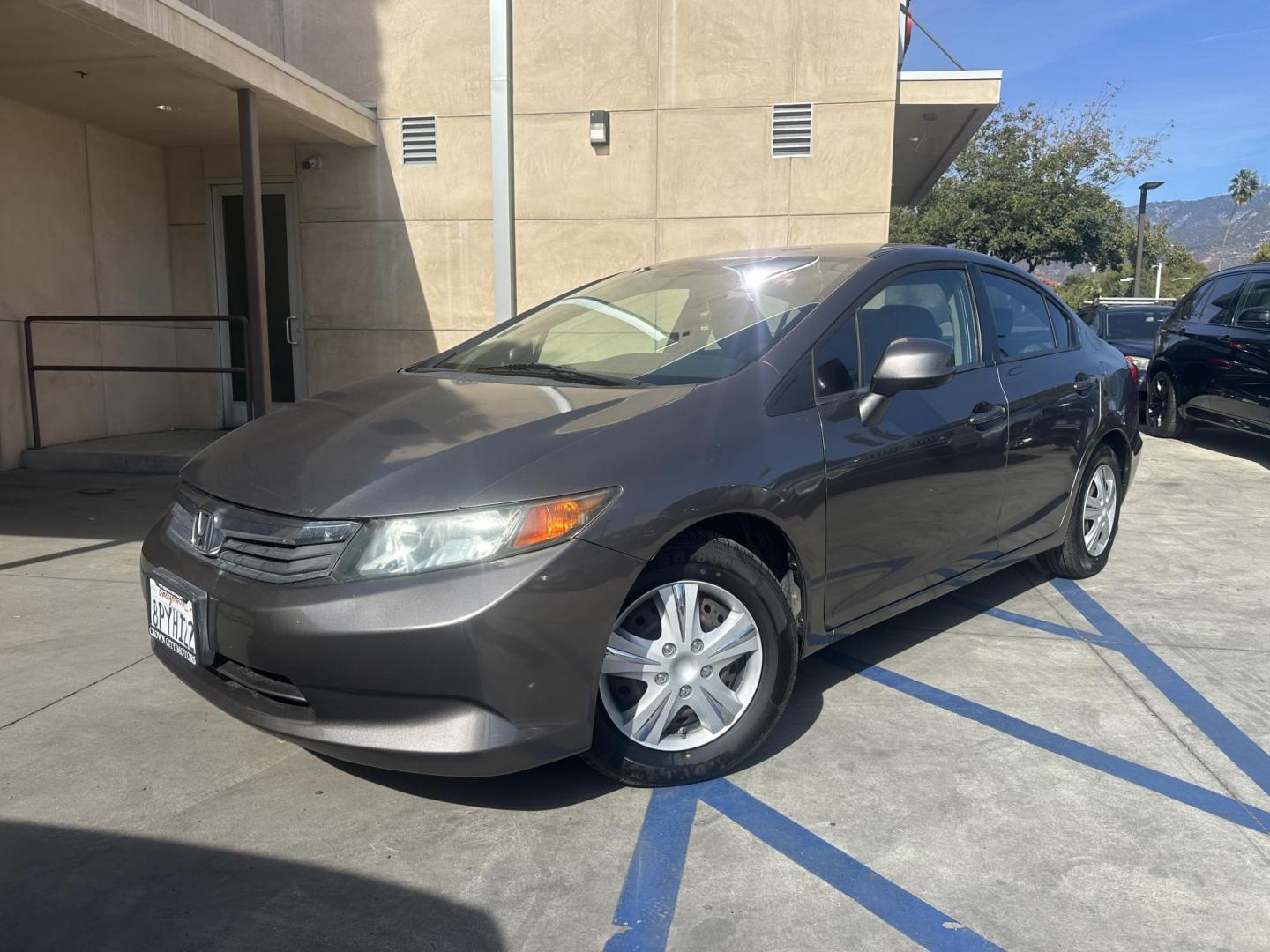 2012 Urban Titanium Metallic /Tan Honda Civic LX Sedan 5-Speed AT (19XFB2F59CE) with an 1.8L L4 SOHC 16V engine, 5-Speed Automatic transmission, located at 30 S. Berkeley Avenue, Pasadena, CA, 91107, (626) 248-7567, 34.145447, -118.109398 - This 2012 Honda Civic LX Sedan automatic looks and drives good. Bad credit, we can help. We are the bank. This Honda Civic LX comes with the following : Options A-C Adjustable Steering Wheel AM-FM Stereo Auxiliary Audio Input Brake Assist Bucket Seats CD Player Child Safet - Photo#0