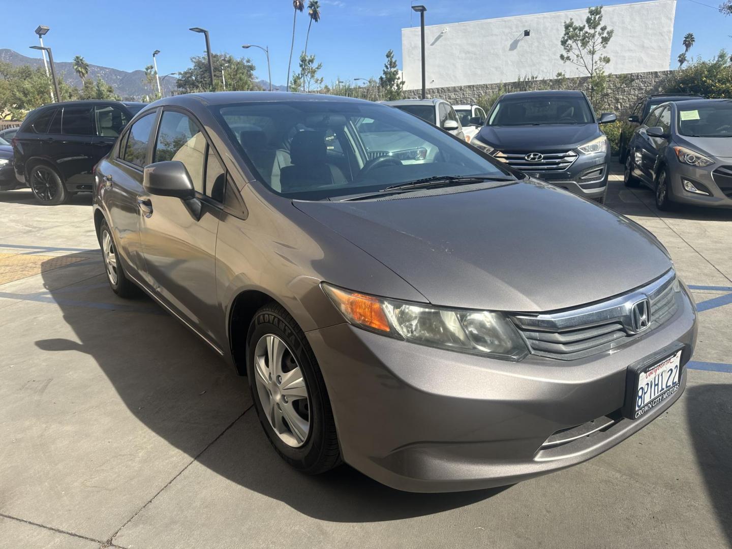 2012 Urban Titanium Metallic /Tan Honda Civic LX Sedan 5-Speed AT (19XFB2F59CE) with an 1.8L L4 SOHC 16V engine, 5-Speed Automatic transmission, located at 30 S. Berkeley Avenue, Pasadena, CA, 91107, (626) 248-7567, 34.145447, -118.109398 - This 2012 Honda Civic LX Sedan automatic looks and drives good. Bad credit, we can help. We are the bank. This Honda Civic LX comes with the following : Options A-C Adjustable Steering Wheel AM-FM Stereo Auxiliary Audio Input Brake Assist Bucket Seats CD Player Child Safet - Photo#7