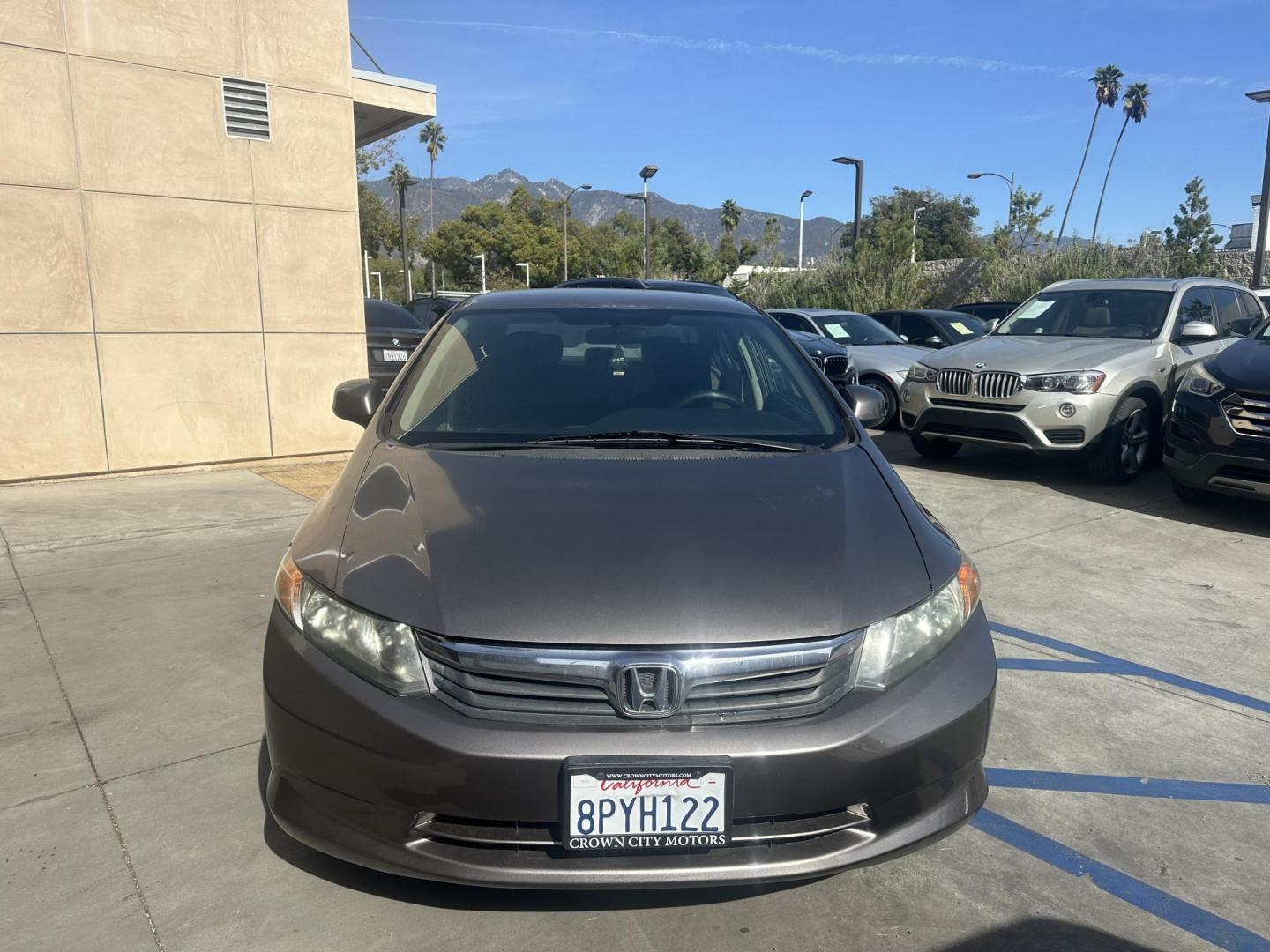 2012 Urban Titanium Metallic /Tan Honda Civic LX Sedan 5-Speed AT (19XFB2F59CE) with an 1.8L L4 SOHC 16V engine, 5-Speed Automatic transmission, located at 30 S. Berkeley Avenue, Pasadena, CA, 91107, (626) 248-7567, 34.145447, -118.109398 - This 2012 Honda Civic LX Sedan automatic looks and drives good. Bad credit, we can help. We are the bank. This Honda Civic LX comes with the following : Options A-C Adjustable Steering Wheel AM-FM Stereo Auxiliary Audio Input Brake Assist Bucket Seats CD Player Child Safet - Photo#8