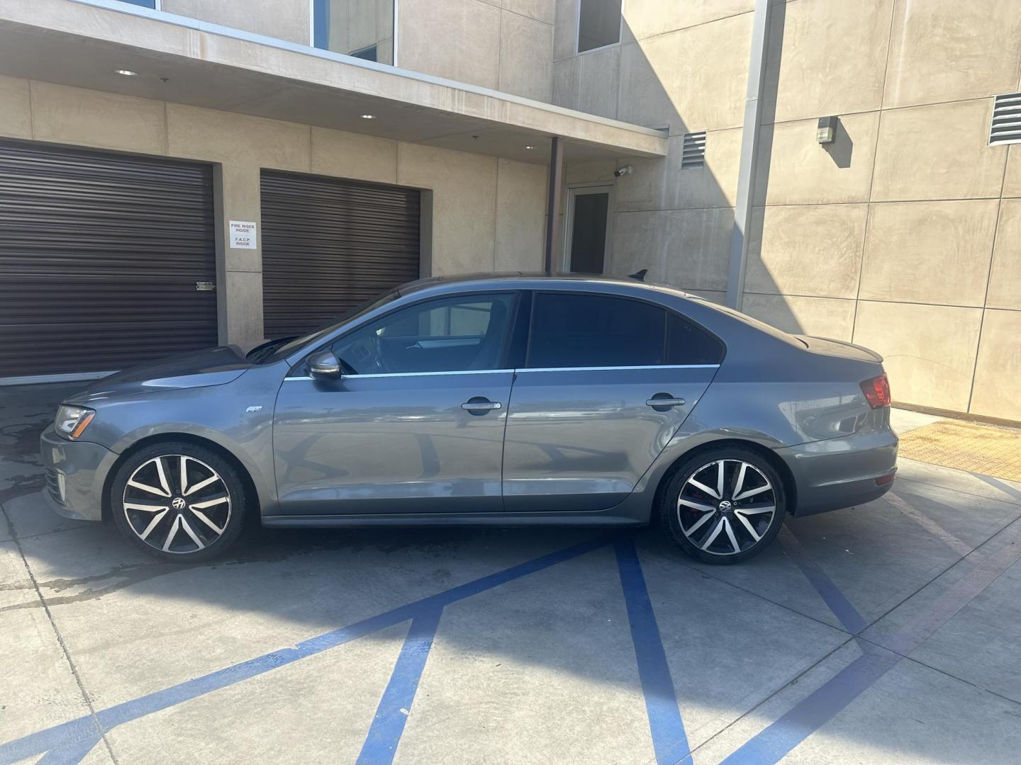 2013 Mineral Gray Metallic /Black Volkswagen Jetta 2.0T GLI (3VW4A7AJ7DM) with an 2.0L L4 DOHC 16V TURBO engine, Automatic transmission, located at 30 S. Berkeley Avenue, Pasadena, CA, 91107, (626) 248-7567, 34.145447, -118.109398 - Leather seats! Moon-roof! Push start! Navigation! Back-up camera! This 2013 Volkswagen Jetta 2.0T GLI looks and drives good. - Photo#1