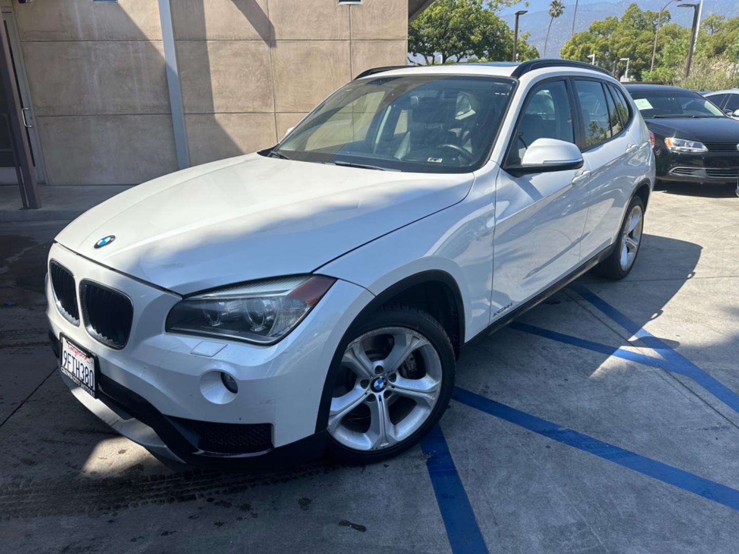 2013 WHITE /Tan BMW X1 xDrive35i (WBAVM5C54DV) with an 3.0L L6 DOHC 24V engine, 6-Speed Automatic transmission, located at 30 S. Berkeley Avenue, Pasadena, CA, 91107, (626) 248-7567, 34.145447, -118.109398 - Navigation! Panoramic-roof! Back up camera! Premium package! AWD! This 2013 BMW X1 xDrive35i looks and drives well. - Photo#0