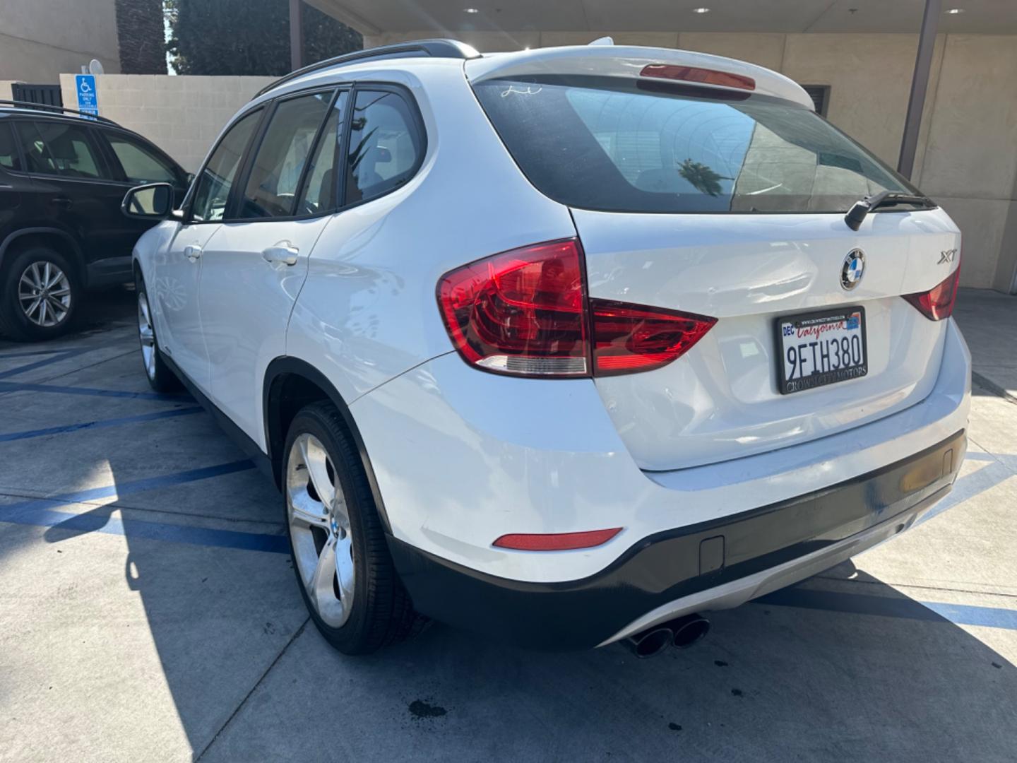 2013 WHITE /Tan BMW X1 xDrive35i (WBAVM5C54DV) with an 3.0L L6 DOHC 24V engine, 6-Speed Automatic transmission, located at 30 S. Berkeley Avenue, Pasadena, CA, 91107, (626) 248-7567, 34.145447, -118.109398 - Navigation! Panoramic-roof! Back up camera! Premium package! AWD! This 2013 BMW X1 xDrive35i looks and drives well. - Photo#2