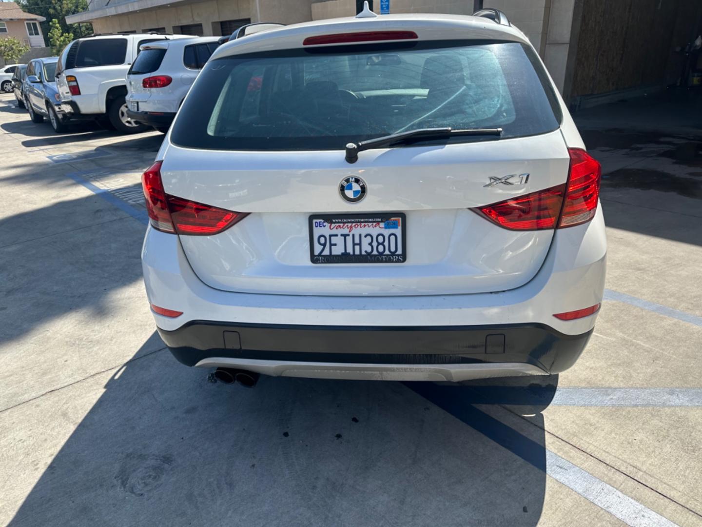 2013 WHITE /Tan BMW X1 xDrive35i (WBAVM5C54DV) with an 3.0L L6 DOHC 24V engine, 6-Speed Automatic transmission, located at 30 S. Berkeley Avenue, Pasadena, CA, 91107, (626) 248-7567, 34.145447, -118.109398 - Navigation! Panoramic-roof! Back up camera! Premium package! AWD! This 2013 BMW X1 xDrive35i looks and drives well. - Photo#3