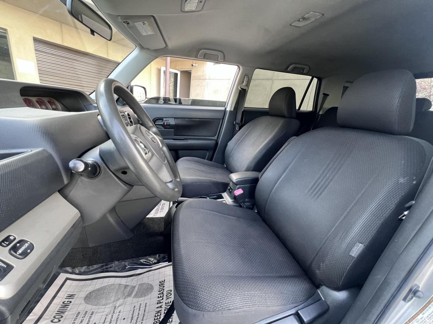 2008 Silver Scion xB Wagon (JTLKE50EX81) with an 2.4L L4 DOHC 16V engine, AUTOMATIC transmission, located at 30 S. Berkeley Avenue, Pasadena, CA, 91107, (626) 248-7567, 34.145447, -118.109398 - NEW TIRES, NEW , RUNS WELL This Scion looks and drives good. bad Credit? We Can Help! Call us today and ask about our finance and lease options . This Scion is equipped with the following A-C Adjustable Steering Wheel AM-FM Stereo Automatic Headlights Auxiliary Audio Input Bucket Seats CD Player Cr - Photo#9