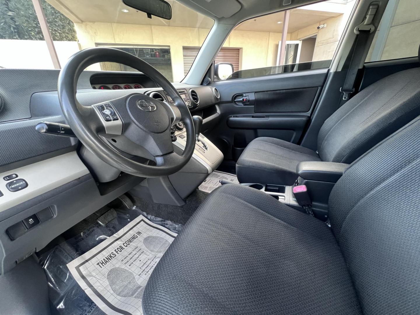 2008 Silver Scion xB Wagon (JTLKE50EX81) with an 2.4L L4 DOHC 16V engine, AUTOMATIC transmission, located at 30 S. Berkeley Avenue, Pasadena, CA, 91107, (626) 248-7567, 34.145447, -118.109398 - NEW TIRES, NEW , RUNS WELL This Scion looks and drives good. bad Credit? We Can Help! Call us today and ask about our finance and lease options . This Scion is equipped with the following A-C Adjustable Steering Wheel AM-FM Stereo Automatic Headlights Auxiliary Audio Input Bucket Seats CD Player Cr - Photo#11