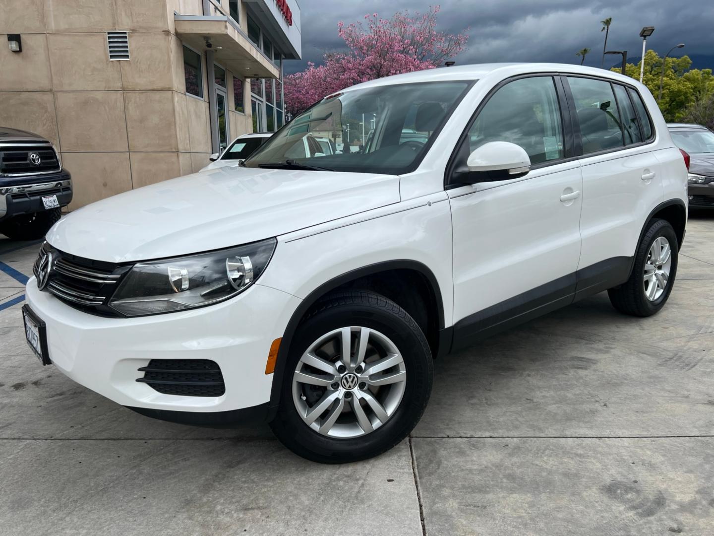 2014 White Volkswagen Tiguan S (WVGAV3AX0EW) with an 2.0L L4 DOHC 16V TURBO engine, AUTOMATIC transmission, located at 30 S. Berkeley Avenue, Pasadena, CA, 91107, (626) 248-7567, 34.145447, -118.109398 - Crown City Motors is a used “Buy Here Pay Here” car dealer in Pasadena CA. “Buy Here Pay Here” financing, means that when you purchase your vehicle from our dealership, that you make the payments to the dealership as well. We do not need the banks approval to get you approved for a used auto - Photo#0