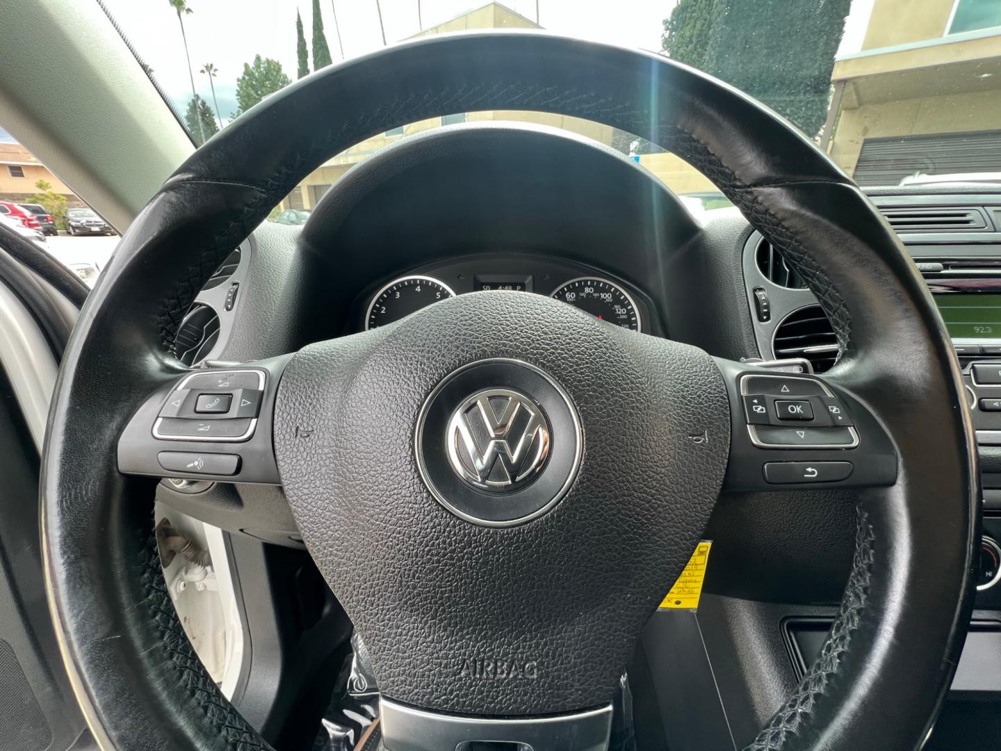 2014 White Volkswagen Tiguan S (WVGAV3AX0EW) with an 2.0L L4 DOHC 16V TURBO engine, AUTOMATIC transmission, located at 30 S. Berkeley Avenue, Pasadena, CA, 91107, (626) 248-7567, 34.145447, -118.109398 - Crown City Motors is a used “Buy Here Pay Here” car dealer in Pasadena CA. “Buy Here Pay Here” financing, means that when you purchase your vehicle from our dealership, that you make the payments to the dealership as well. We do not need the banks approval to get you approved for a used auto - Photo#19