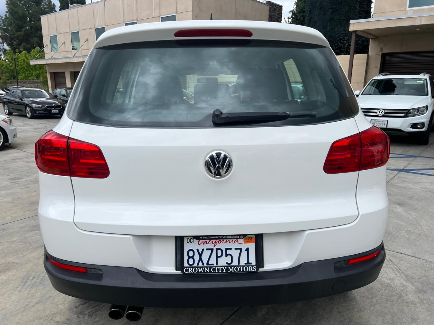 2014 White Volkswagen Tiguan S (WVGAV3AX0EW) with an 2.0L L4 DOHC 16V TURBO engine, AUTOMATIC transmission, located at 30 S. Berkeley Avenue, Pasadena, CA, 91107, (626) 248-7567, 34.145447, -118.109398 - Crown City Motors is a used “Buy Here Pay Here” car dealer in Pasadena CA. “Buy Here Pay Here” financing, means that when you purchase your vehicle from our dealership, that you make the payments to the dealership as well. We do not need the banks approval to get you approved for a used auto - Photo#3