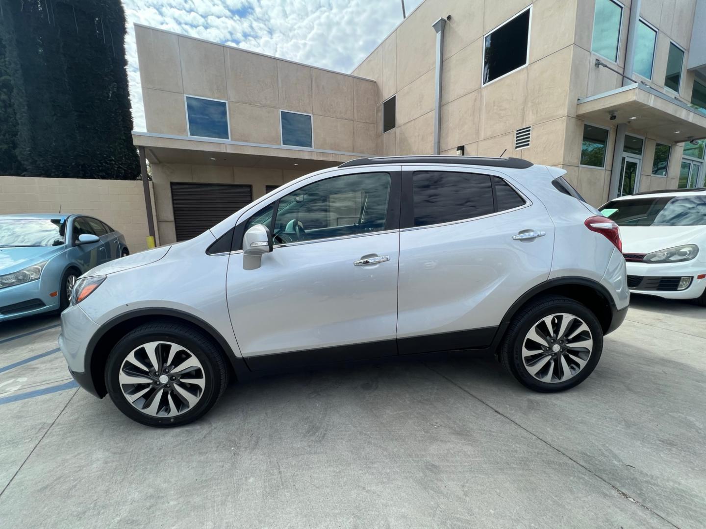 2018 Silver Buick Encore Essence AWD (KL4CJGSB7JB) with an 1.4L L4 DOHC 16V TURBO engine, 6A transmission, located at 30 S. Berkeley Avenue, Pasadena, CA, 91107, (626) 248-7567, 34.145447, -118.109398 - Crown City Motors is a used “Buy Here Pay Here” car dealer in Pasadena CA. “Buy Here Pay Here” financing, means that when you purchase your vehicle from our dealership, that you make the payments to the dealership as well. We do not need the banks approval to get you approved for a used auto - Photo#1