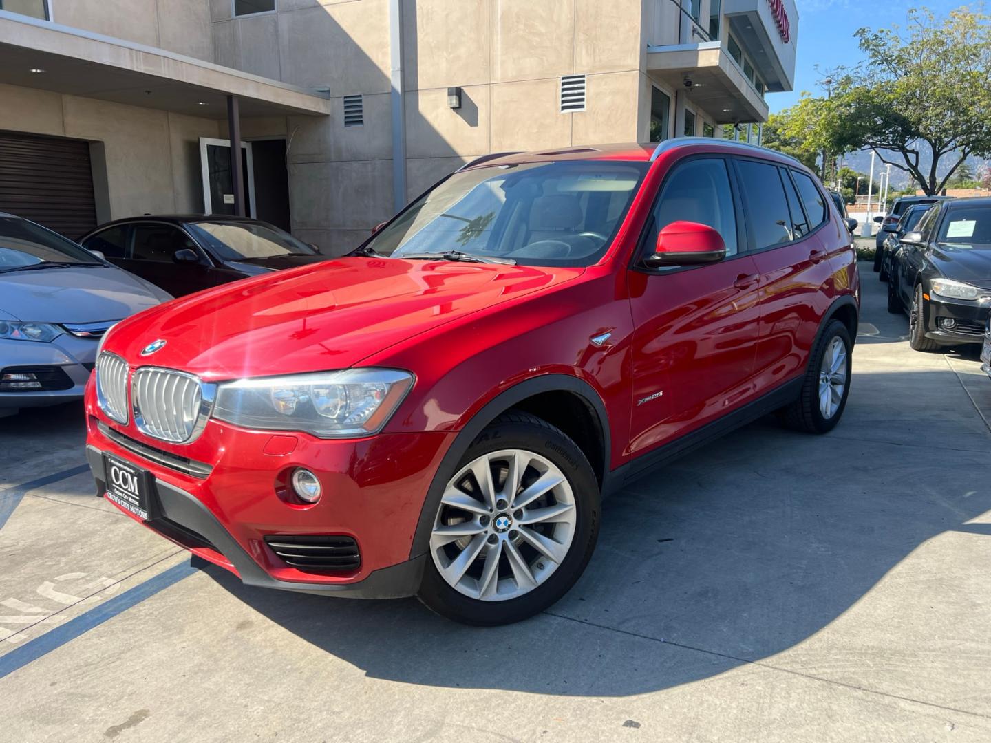 2016 RED /Tan BMW X3 xDrive28i (5UXWX9C50G0) with an 2.0L L4 DOHC 16V engine, 8-Speed Automatic transmission, located at 30 S. Berkeley Avenue, Pasadena, CA, 91107, (626) 248-7567, 34.145447, -118.109398 - Crown City Motors is a used “Buy Here Pay Here” car dealer in Pasadena CA. “Buy Here Pay Here” financing, means that when you purchase your vehicle from our dealership, that you make the payments to the dealership as well. We do not need the banks approval to get you approved for a used auto - Photo#0