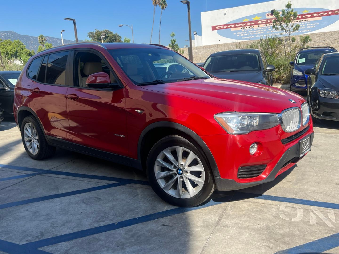 2016 RED /Tan BMW X3 xDrive28i (5UXWX9C50G0) with an 2.0L L4 DOHC 16V engine, 8-Speed Automatic transmission, located at 30 S. Berkeley Avenue, Pasadena, CA, 91107, (626) 248-7567, 34.145447, -118.109398 - Crown City Motors is a used “Buy Here Pay Here” car dealer in Pasadena CA. “Buy Here Pay Here” financing, means that when you purchase your vehicle from our dealership, that you make the payments to the dealership as well. We do not need the banks approval to get you approved for a used auto - Photo#4