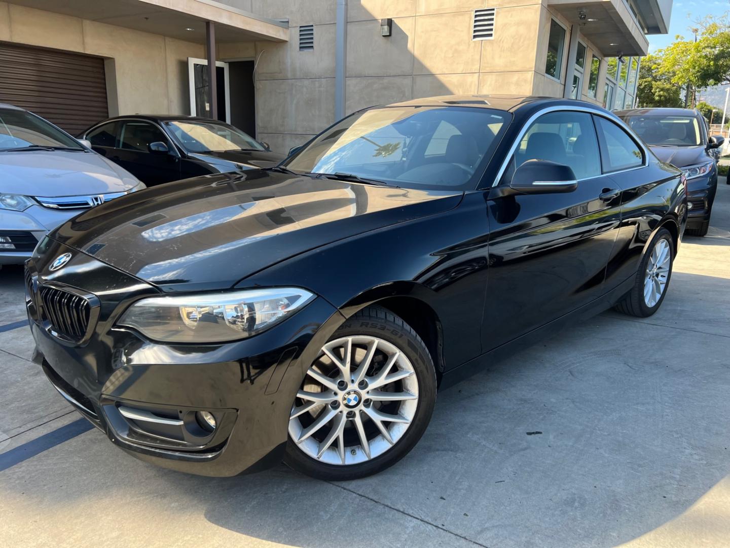 2016 Black BMW 2-Series 228i SULEV Coupe (WBA1F9C51GV) with an 2.0L L4 DOHC 16V engine, 8A transmission, located at 30 S. Berkeley Avenue, Pasadena, CA, 91107, (626) 248-7567, 34.145447, -118.109398 - Photo#0