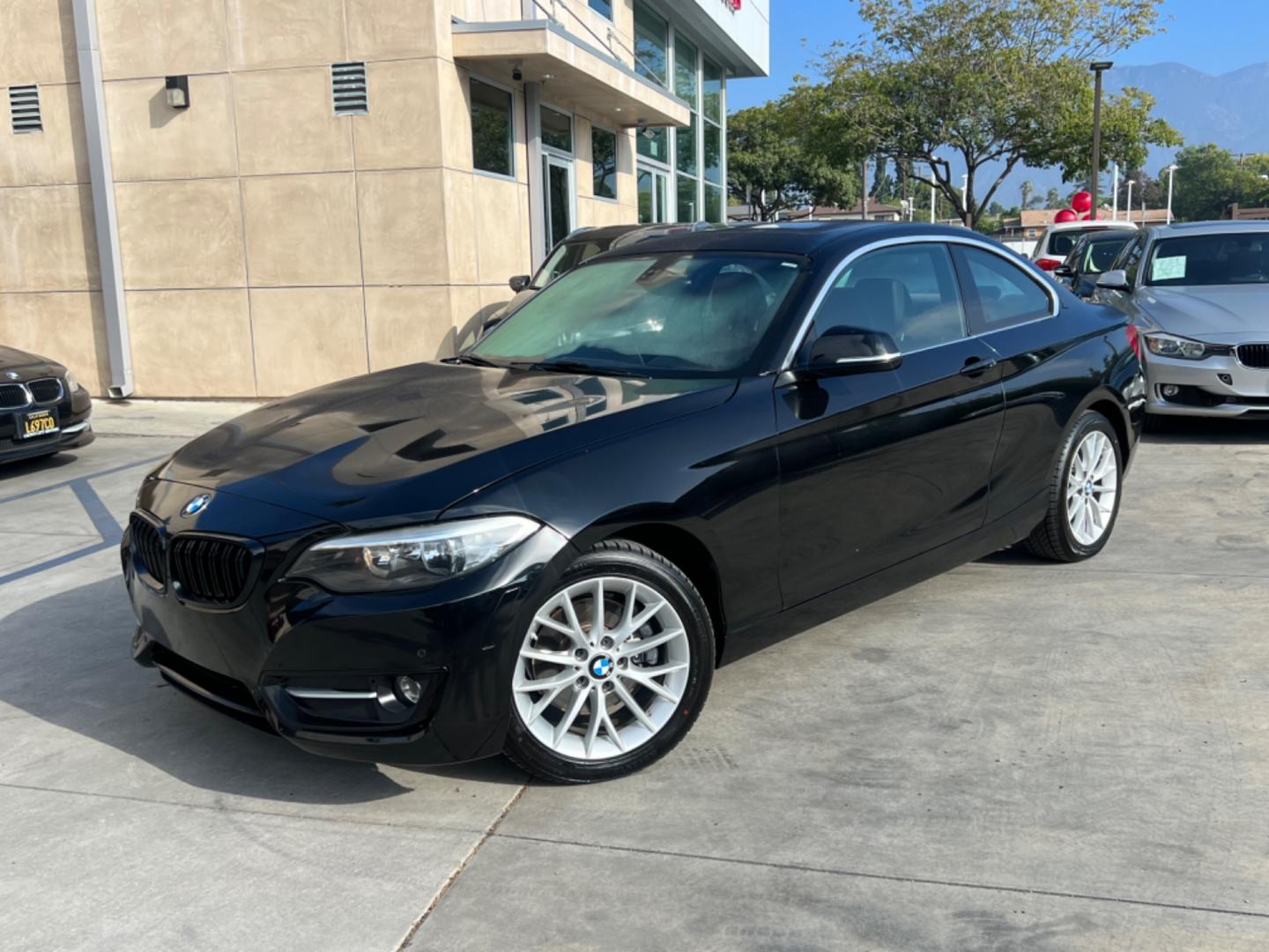 2016 Black BMW 2-Series 228i SULEV Coupe (WBA1F9C51GV) with an 2.0L L4 DOHC 16V engine, 8A transmission, located at 30 S. Berkeley Avenue, Pasadena, CA, 91107, (626) 248-7567, 34.145447, -118.109398 - Photo#1