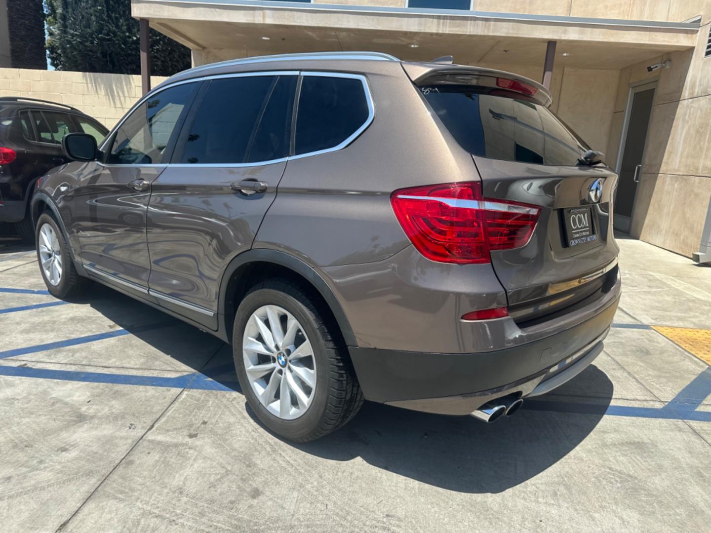 2013 Chestnut Bronze Metallic /Black BMW X3 Leather (5UXWX9C53D0) with an 2.0 engine, Automatic transmission, located at 30 S. Berkeley Avenue, Pasadena, CA, 91107, (626) 248-7567, 34.145447, -118.109398 - 2013 BMW X3 2.0 Turbo: Your Ideal Pre-Owned Luxury SUV in Pasadena, CA When searching for used BHPH cars in Pasadena, CA, the 2013 BMW X3 2.0 Turbo stands out as a premier choice. This luxury compact SUV combines performance, style, and comfort, making it a highly sought-after vehicle in the pre-ow - Photo#3