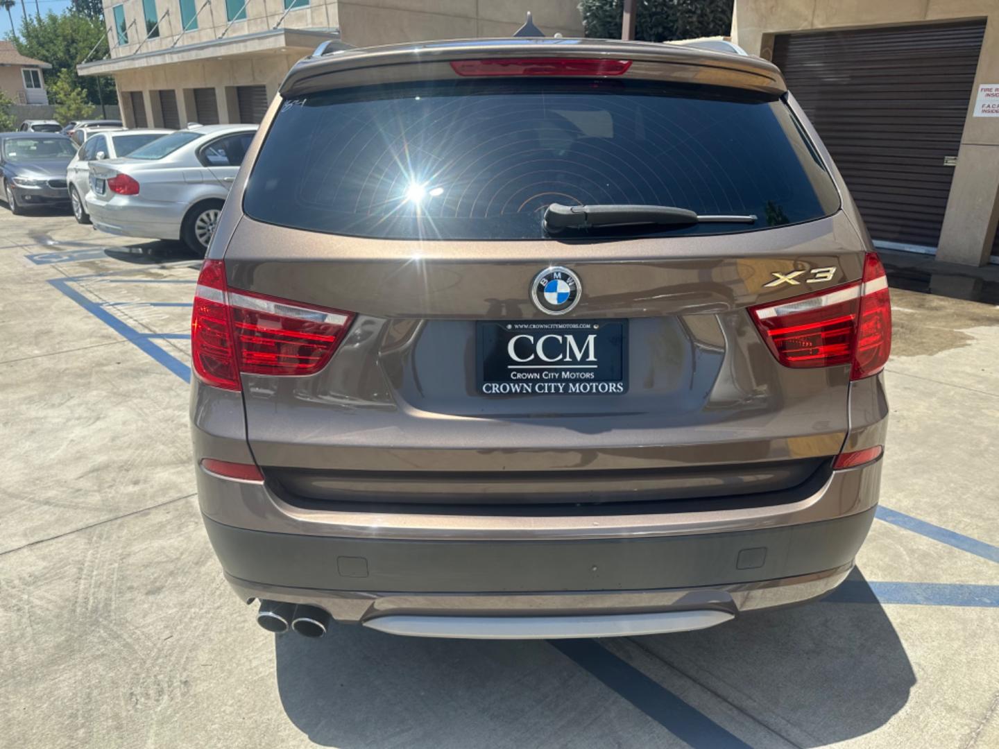 2013 Chestnut Bronze Metallic /Black BMW X3 Leather (5UXWX9C53D0) with an 2.0 engine, Automatic transmission, located at 30 S. Berkeley Avenue, Pasadena, CA, 91107, (626) 248-7567, 34.145447, -118.109398 - 2013 BMW X3 2.0 Turbo: Your Ideal Pre-Owned Luxury SUV in Pasadena, CA When searching for used BHPH cars in Pasadena, CA, the 2013 BMW X3 2.0 Turbo stands out as a premier choice. This luxury compact SUV combines performance, style, and comfort, making it a highly sought-after vehicle in the pre-ow - Photo#4