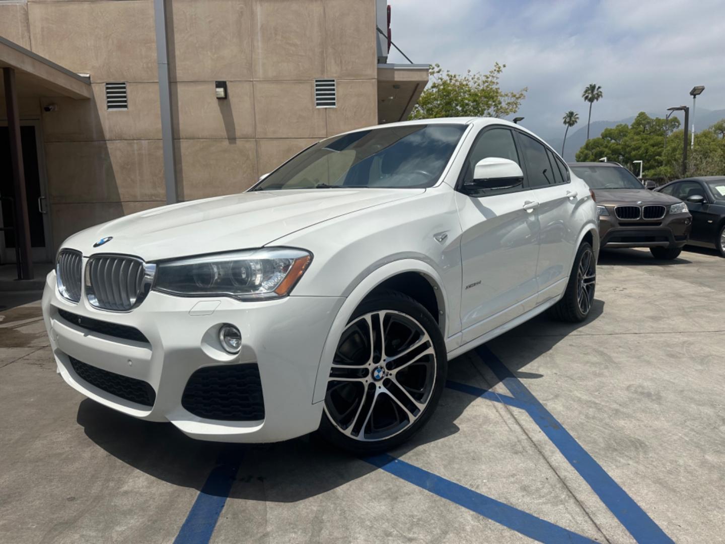 2015 Alpine White /Black BMW X4 Leather (5UXXW3C59F0) with an 2.0 engine, Automatic transmission, located at 30 S. Berkeley Avenue, Pasadena, CA, 91107, (626) 248-7567, 34.145447, -118.109398 - Discover the 2015 BMW X4 xDrive28i: Luxury Meets Affordability Are you in the market for a luxury vehicle that doesn't break the bank? Look no further than the 2015 BMW X4 xDrive28i. This impressive model offers the perfect blend of performance, style, and affordability. At our dealership, we under - Photo#1