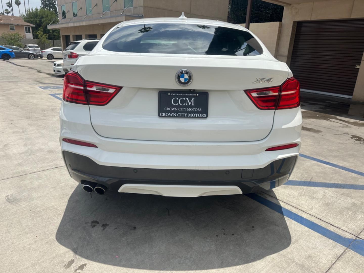 2015 Alpine White /Black BMW X4 Leather (5UXXW3C59F0) with an 2.0 engine, Automatic transmission, located at 30 S. Berkeley Avenue, Pasadena, CA, 91107, (626) 248-7567, 34.145447, -118.109398 - Discover the 2015 BMW X4 xDrive28i: Luxury Meets Affordability Are you in the market for a luxury vehicle that doesn't break the bank? Look no further than the 2015 BMW X4 xDrive28i. This impressive model offers the perfect blend of performance, style, and affordability. At our dealership, we under - Photo#4