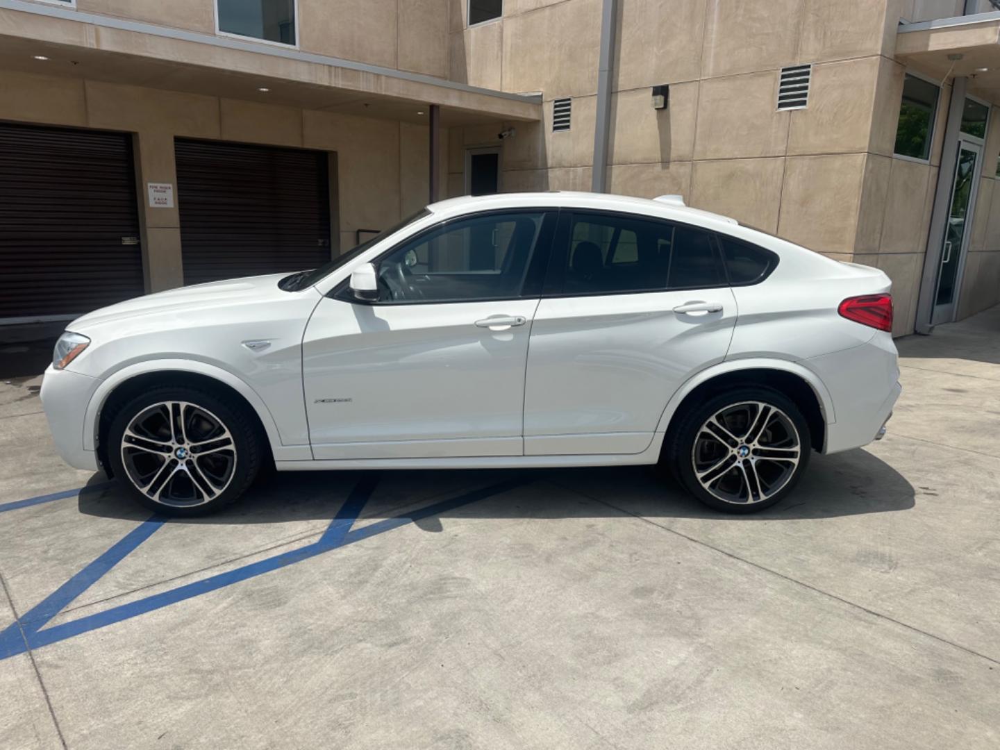 2015 Alpine White /Black BMW X4 Leather (5UXXW3C59F0) with an 2.0 engine, Automatic transmission, located at 30 S. Berkeley Avenue, Pasadena, CA, 91107, (626) 248-7567, 34.145447, -118.109398 - Discover the 2015 BMW X4 xDrive28i: Luxury Meets Affordability Are you in the market for a luxury vehicle that doesn't break the bank? Look no further than the 2015 BMW X4 xDrive28i. This impressive model offers the perfect blend of performance, style, and affordability. At our dealership, we under - Photo#2