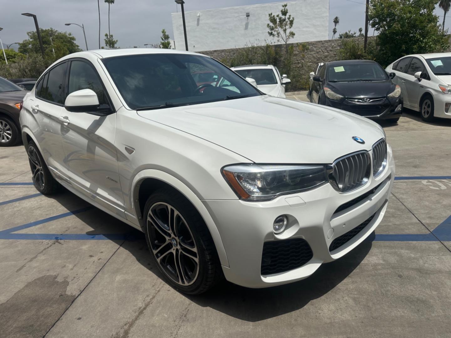 2015 Alpine White /Black BMW X4 Leather (5UXXW3C59F0) with an 2.0 engine, Automatic transmission, located at 30 S. Berkeley Avenue, Pasadena, CA, 91107, (626) 248-7567, 34.145447, -118.109398 - Discover the 2015 BMW X4 xDrive28i: Luxury Meets Affordability Are you in the market for a luxury vehicle that doesn't break the bank? Look no further than the 2015 BMW X4 xDrive28i. This impressive model offers the perfect blend of performance, style, and affordability. At our dealership, we under - Photo#7