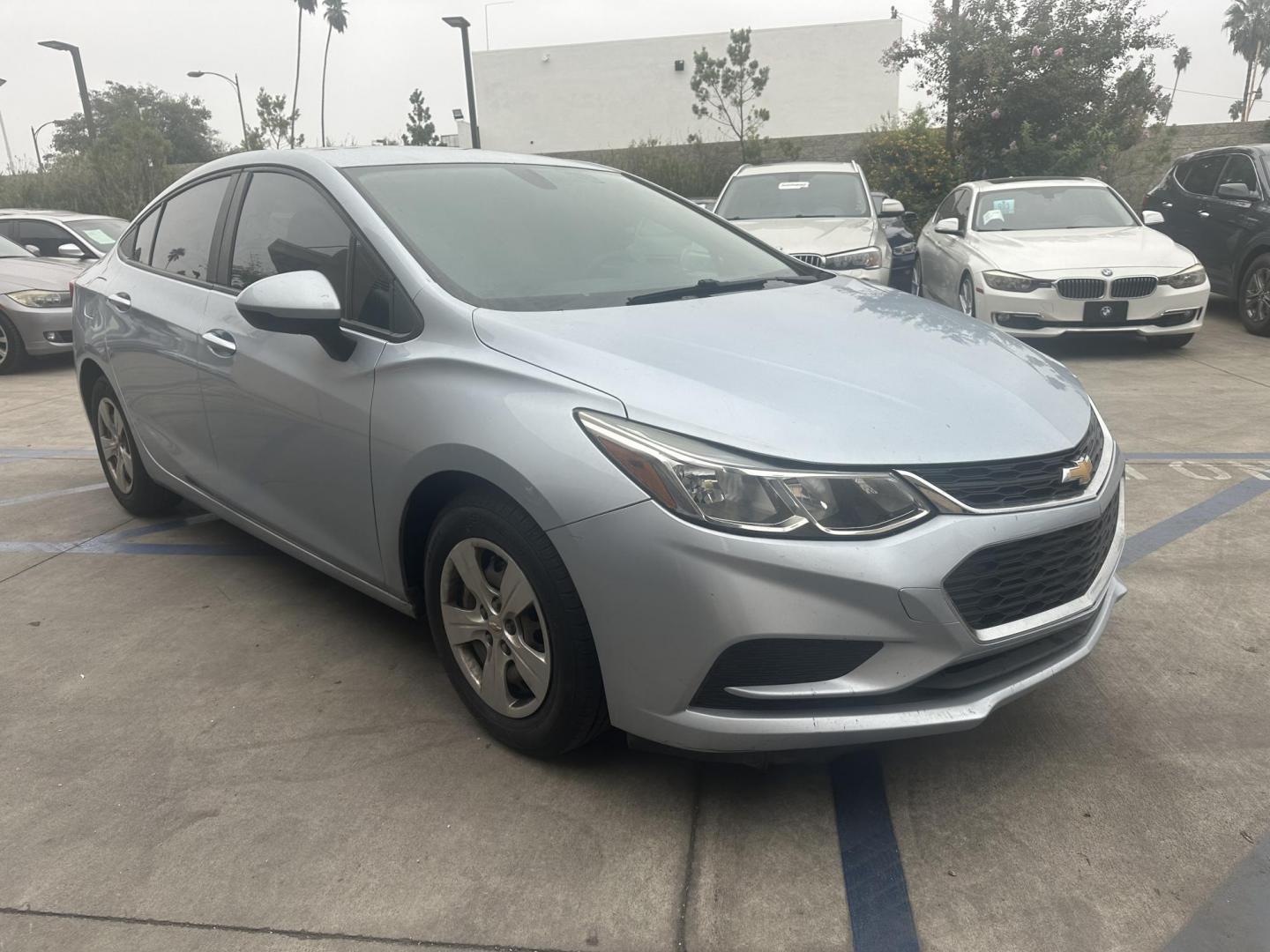 2017 Arctic Blue Metallic. /Gray Chevrolet Cruze LS Auto (1G1BC5SM8H7) with an 1.4L L4 DOHC 16V TURBO engine, 6A transmission, located at 30 S. Berkeley Avenue, Pasadena, CA, 91107, (626) 248-7567, 34.145447, -118.109398 - 017 Chevrolet Cruze: The Compact Car That Delivers Style, Efficiency, and Comfort The 2017 Chevrolet Cruze offers a perfect blend of style, efficiency, and modern technology, making it one of the most popular compact cars in its class. Whether you're looking for a daily commuter or a vehicle that - Photo#2