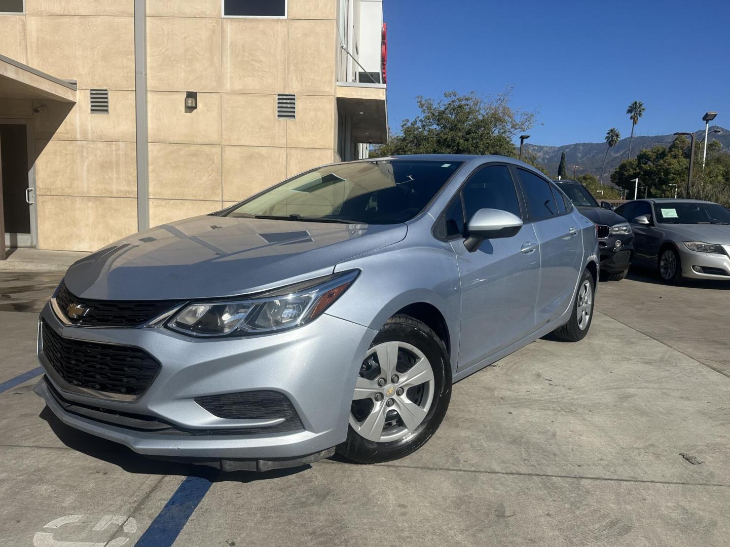 2017 Arctic Blue Metallic. /Gray Chevrolet Cruze LS Auto (1G1BC5SM8H7) with an 1.4L L4 DOHC 16V TURBO engine, 6A transmission, located at 30 S. Berkeley Avenue, Pasadena, CA, 91107, (626) 248-7567, 34.145447, -118.109398 - 017 Chevrolet Cruze: The Compact Car That Delivers Style, Efficiency, and Comfort The 2017 Chevrolet Cruze offers a perfect blend of style, efficiency, and modern technology, making it one of the most popular compact cars in its class. Whether you're looking for a daily commuter or a vehicle that - Photo#4