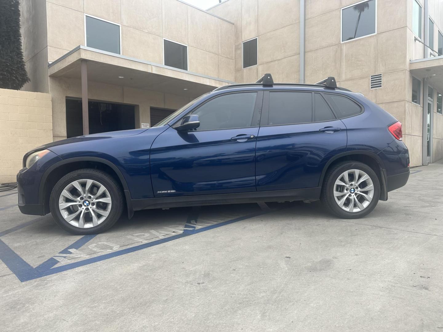 2013 Deep Sea Blue Metallic /Black BMW X1 xDrive28i (WBAVL1C56DV) with an 2.0L L4 DOHC 16V engine, 8-Speed Automatic transmission, located at 30 S. Berkeley Avenue, Pasadena, CA, 91107, (626) 248-7567, 34.145447, -118.109398 - 2013 BMW X1: Luxury, Performance, and Affordable Bad Credit Financing at Buy Here Pay Here Dealerships The 2013 BMW X1 is a luxury compact SUV that offers the perfect combination of sportiness, premium comfort, and advanced technology. As part of BMW’s well-regarded X Series, the X1 stands out - Photo#1