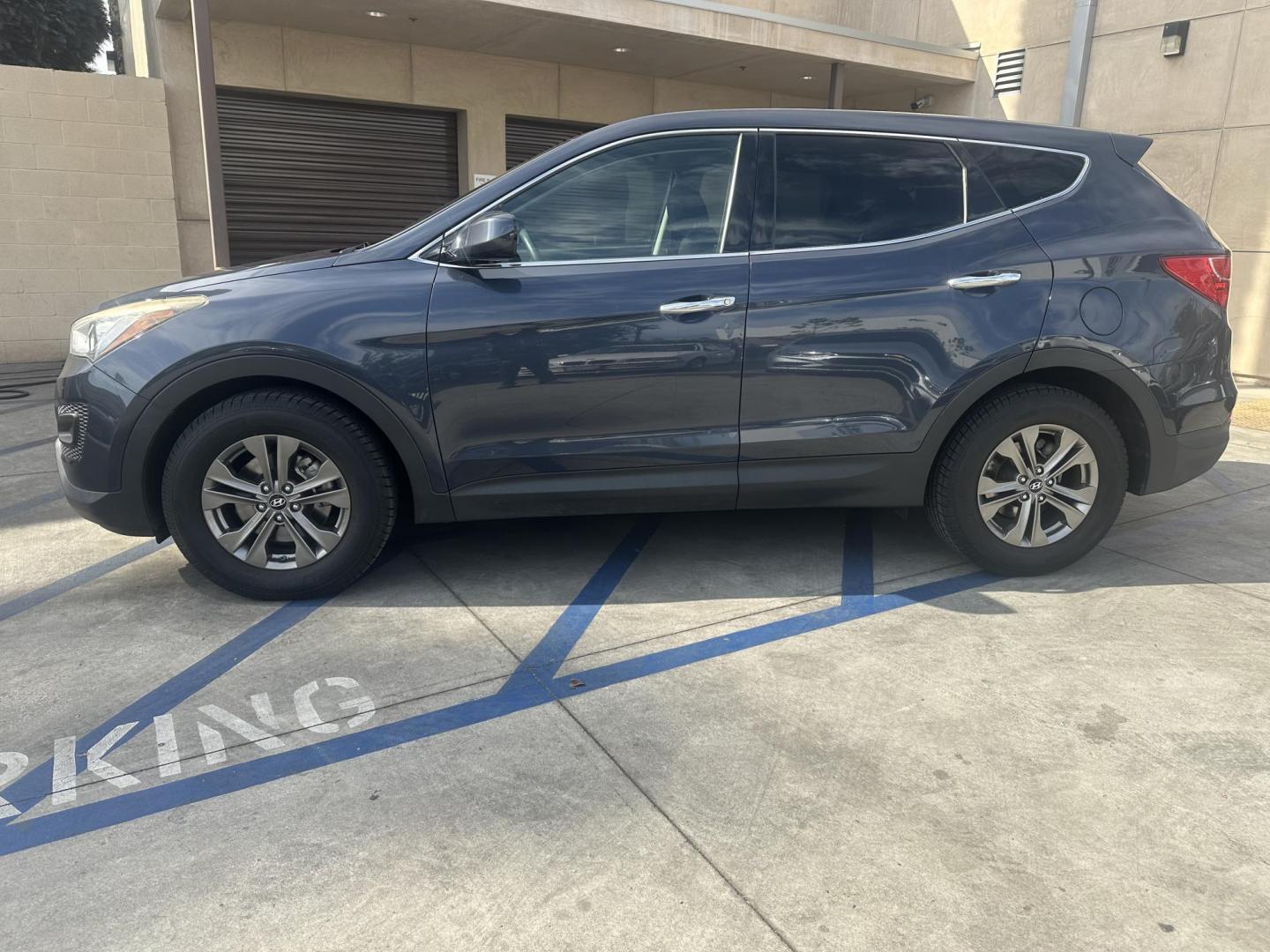 2014 Night Sky Pearl. /Gray Hyundai Santa Fe Sport 2.4 FWD (5XYZT3LB4EG) with an 2.4L L4 DOHC 16V engine, 6-Speed Automatic transmission, located at 30 S. Berkeley Avenue, Pasadena, CA, 91107, (626) 248-7567, 34.145447, -118.109398 - 2014 Hyundai Santa Fe Sport FWD 2.4: Versatility, Comfort, and Affordable Bad Credit Financing at Buy Here Pay Here Dealerships The 2014 Hyundai Santa Fe Sport FWD 2.4 is an exceptional midsize SUV that offers a balance of power, comfort, and affordability. It’s a top choice for families, daily - Photo#4