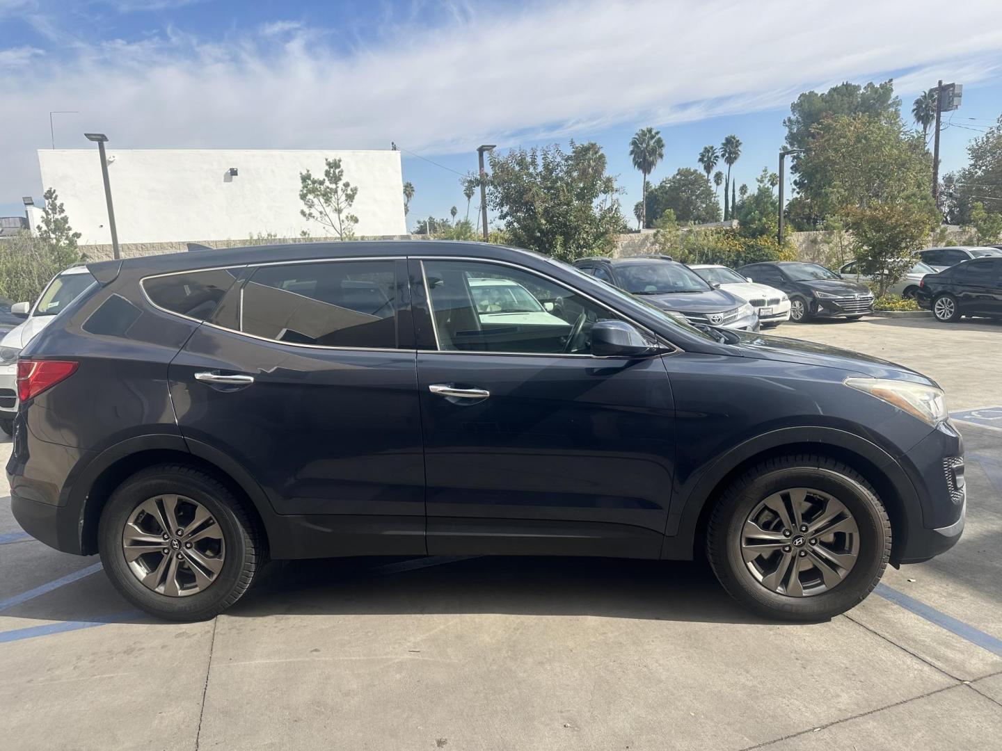 2014 Night Sky Pearl. /Gray Hyundai Santa Fe Sport 2.4 FWD (5XYZT3LB4EG) with an 2.4L L4 DOHC 16V engine, 6-Speed Automatic transmission, located at 30 S. Berkeley Avenue, Pasadena, CA, 91107, (626) 248-7567, 34.145447, -118.109398 - 2014 Hyundai Santa Fe Sport FWD 2.4: Versatility, Comfort, and Affordable Bad Credit Financing at Buy Here Pay Here Dealerships The 2014 Hyundai Santa Fe Sport FWD 2.4 is an exceptional midsize SUV that offers a balance of power, comfort, and affordability. It’s a top choice for families, daily - Photo#8