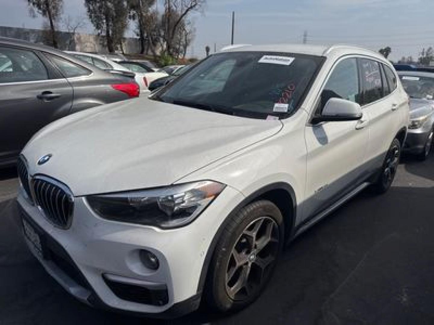 2018 Alpine White /Black BMW X1 sDrive28i (WBXHU7C37J5) with an 2.0L L4 DOHC 16V engine, 8A transmission, located at 30 S. Berkeley Avenue, Pasadena, CA, 91107, (626) 248-7567, 34.145447, -118.109398 - Photo#0