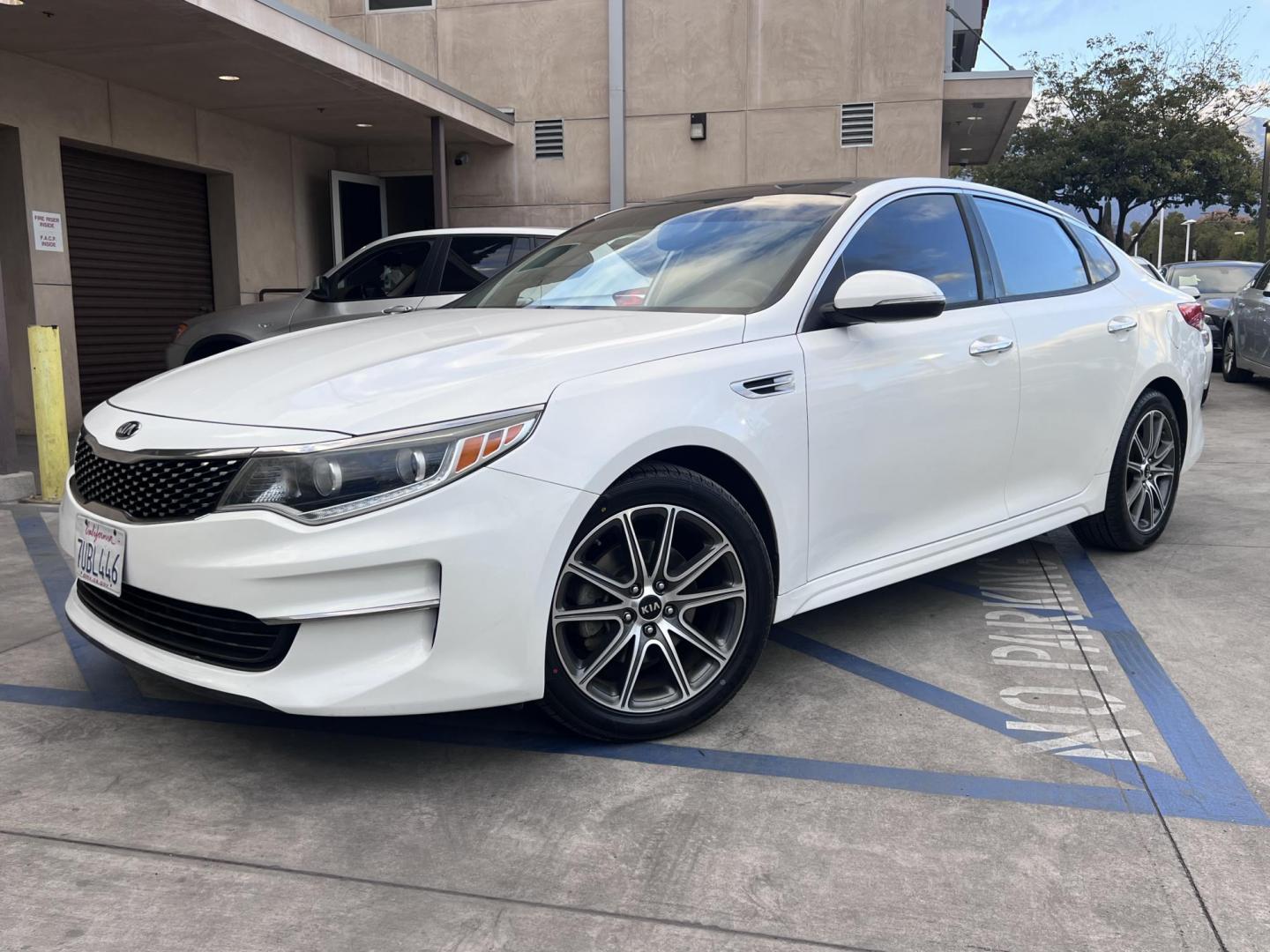 2016 White /Black Kia Optima EX (5XXGU4L3XGG) with an 2.4L L4 DOHC 16V engine, 6A transmission, located at 30 S. Berkeley Avenue, Pasadena, CA, 91107, (626) 248-7567, 34.145447, -118.109398 - Photo#1