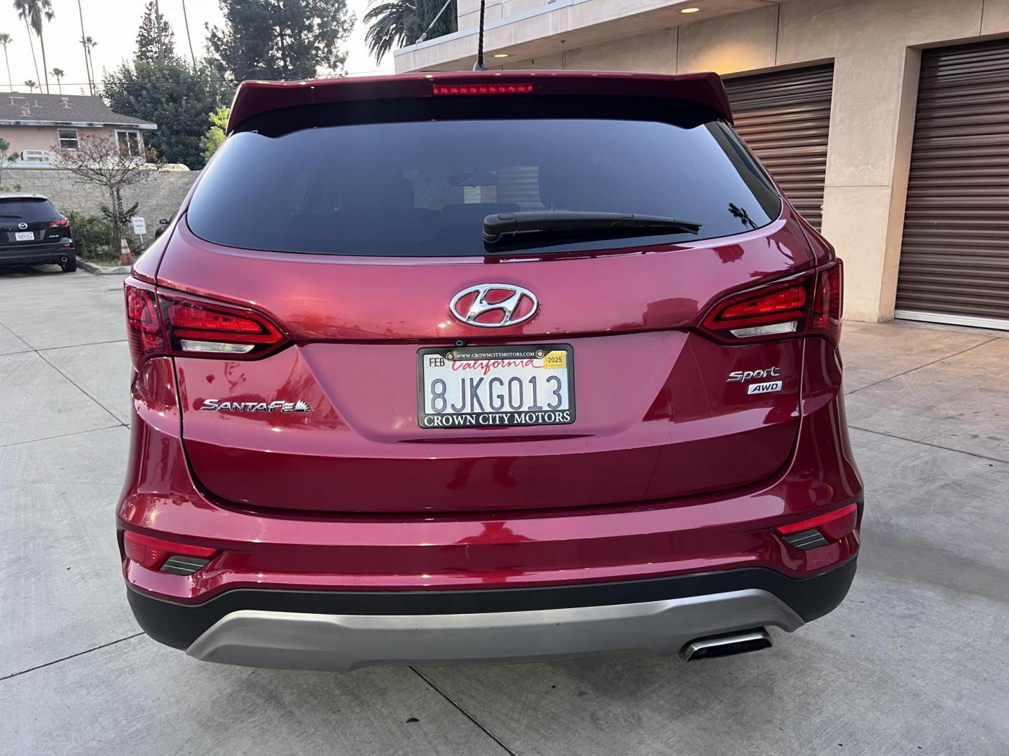 2018 Ruby Red /Black Hyundai Santa Fe Sport 2.4 AWD (5XYZTDLB2JG) with an 2.4L L4 DOHC 16V engine, 6A transmission, located at 30 S. Berkeley Avenue, Pasadena, CA, 91107, (626) 248-7567, 34.145447, -118.109398 - Photo#1