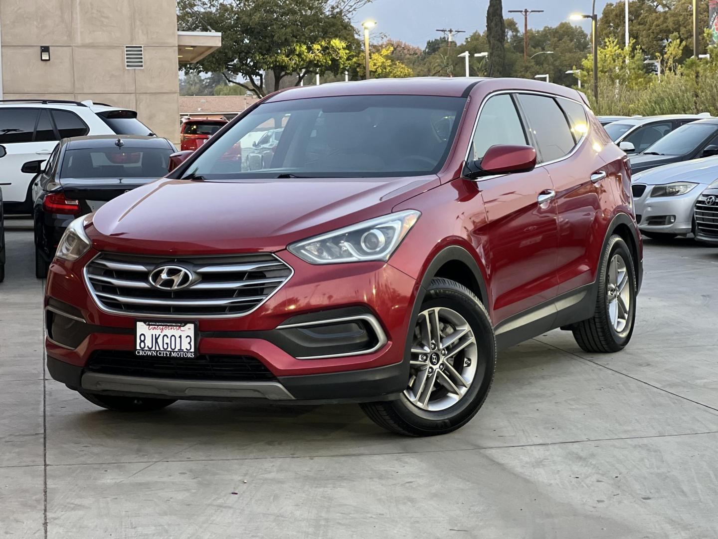 2018 Ruby Red /Black Hyundai Santa Fe Sport 2.4 AWD (5XYZTDLB2JG) with an 2.4L L4 DOHC 16V engine, 6A transmission, located at 30 S. Berkeley Avenue, Pasadena, CA, 91107, (626) 248-7567, 34.145447, -118.109398 - Photo#0