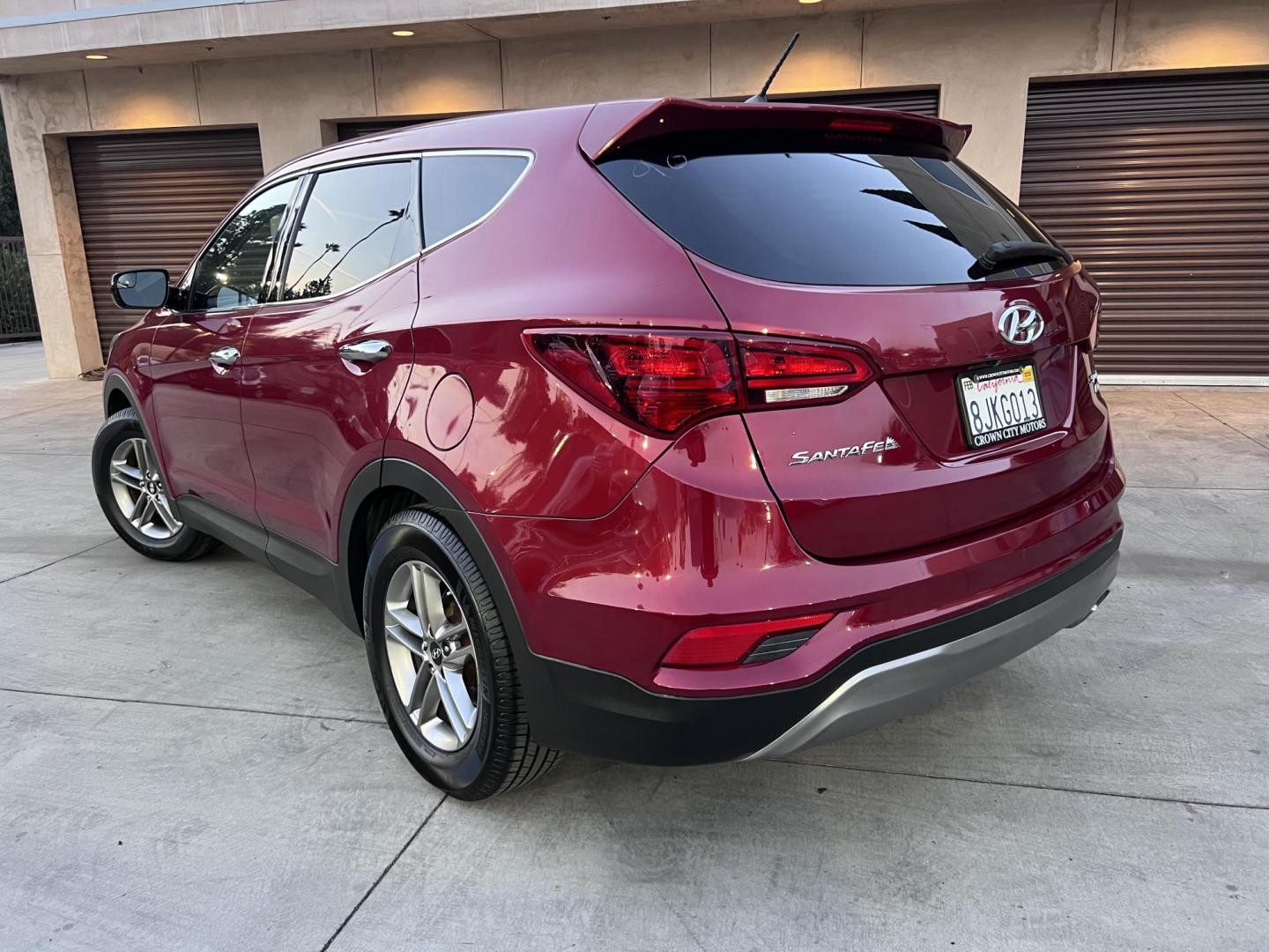 2018 Ruby Red /Black Hyundai Santa Fe Sport 2.4 AWD (5XYZTDLB2JG) with an 2.4L L4 DOHC 16V engine, 6A transmission, located at 30 S. Berkeley Avenue, Pasadena, CA, 91107, (626) 248-7567, 34.145447, -118.109398 - Photo#2