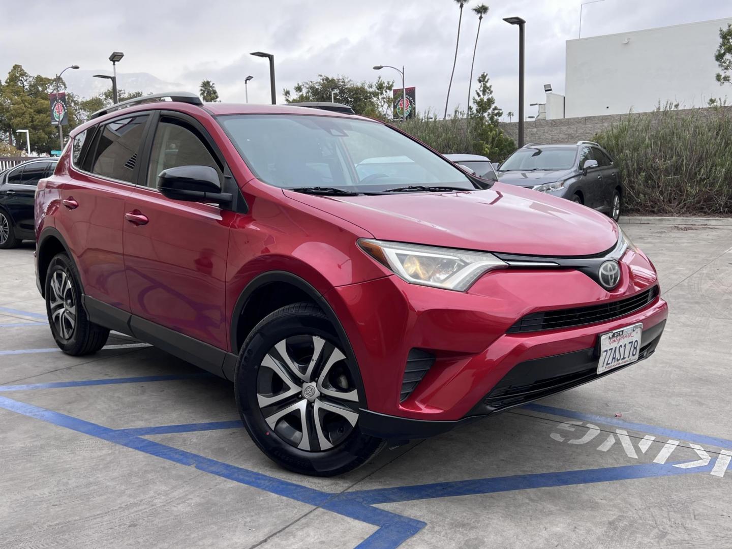 2017 Ruby Red /Gray Toyota RAV4 LE FWD (2T3ZFREV1HW) with an 2.5L L4 DOHC 16V engine, 6A transmission, located at 30 S. Berkeley Avenue, Pasadena, CA, 91107, (626) 248-7567, 34.145447, -118.109398 - 2017 Toyota RAV4: Reliable and Versatile SUV Available with Buy Here Pay Here Auto Loan Financing—Bad Credit? No Problem! Looking for a dependable, stylish, and feature-packed SUV that fits your lifestyle? The 2017 Toyota RAV4 is the perfect choice for drivers who value reliability, efficiency, - Photo#6