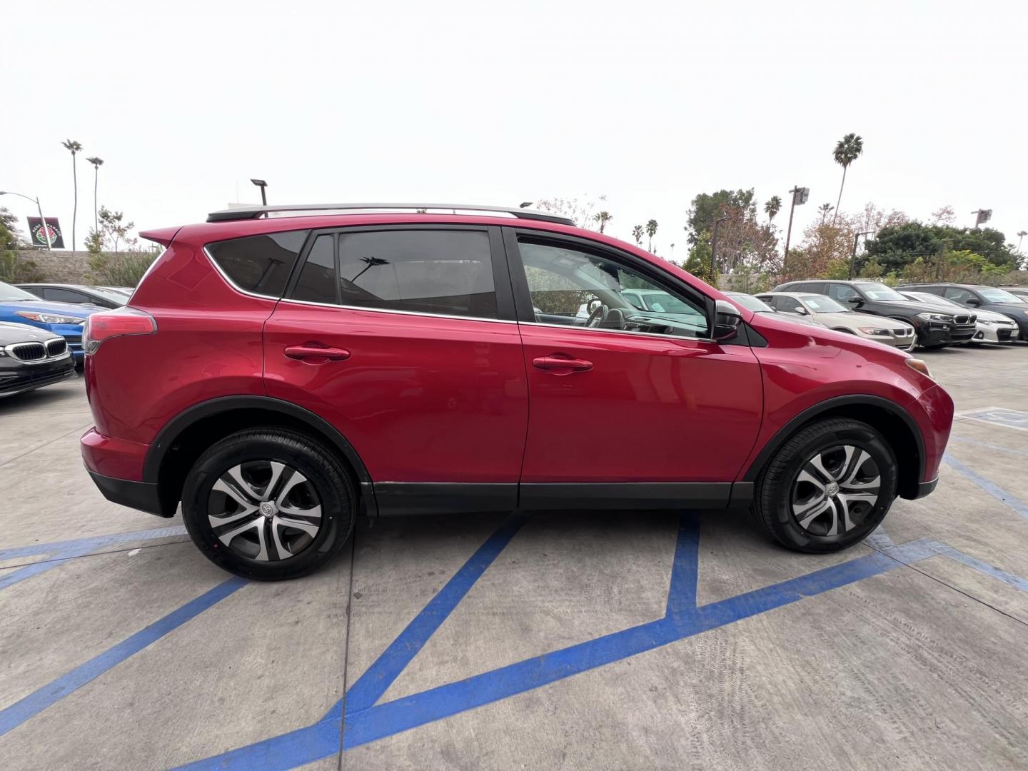 2017 Ruby Red /Gray Toyota RAV4 LE FWD (2T3ZFREV1HW) with an 2.5L L4 DOHC 16V engine, 6A transmission, located at 30 S. Berkeley Avenue, Pasadena, CA, 91107, (626) 248-7567, 34.145447, -118.109398 - 2017 Toyota RAV4: Reliable and Versatile SUV Available with Buy Here Pay Here Auto Loan Financing—Bad Credit? No Problem! Looking for a dependable, stylish, and feature-packed SUV that fits your lifestyle? The 2017 Toyota RAV4 is the perfect choice for drivers who value reliability, efficiency, - Photo#1