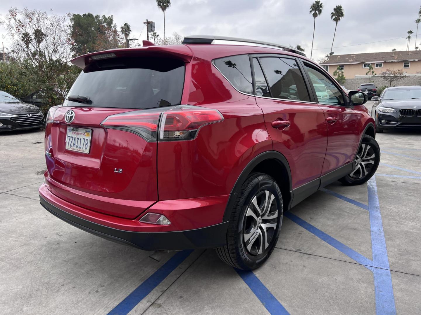 2017 Ruby Red /Gray Toyota RAV4 LE FWD (2T3ZFREV1HW) with an 2.5L L4 DOHC 16V engine, 6A transmission, located at 30 S. Berkeley Avenue, Pasadena, CA, 91107, (626) 248-7567, 34.145447, -118.109398 - 2017 Toyota RAV4: Reliable and Versatile SUV Available with Buy Here Pay Here Auto Loan Financing—Bad Credit? No Problem! Looking for a dependable, stylish, and feature-packed SUV that fits your lifestyle? The 2017 Toyota RAV4 is the perfect choice for drivers who value reliability, efficiency, - Photo#4