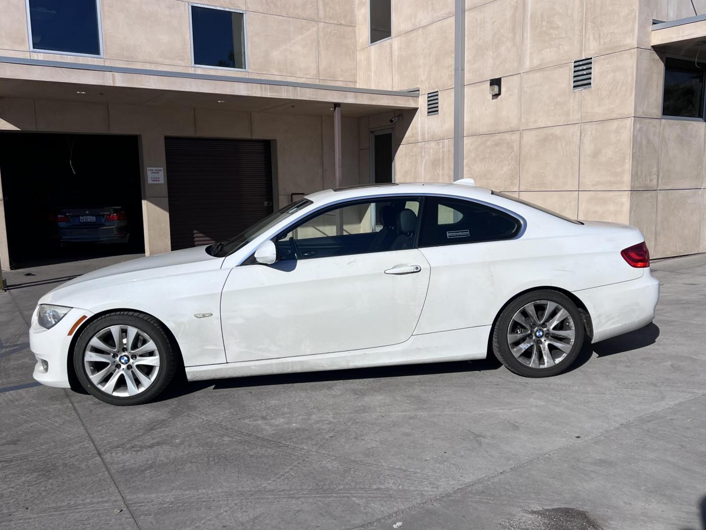 2013 Alpine White /Black BMW 3-Series 328i Coupe - SULEV (WBAKE5C56DJ) with an 3.0L L6 DOHC 24V engine, Automatic transmission, located at 30 S. Berkeley Avenue, Pasadena, CA, 91107, (626) 248-7567, 34.145447, -118.109398 - 2013 BMW 328 Coupe with 3.0L V6 Engine, Navigation, and Panoramic Roof Unleash the thrill of driving with this exquisite 2013 BMW 328 Coupe, now available at Crown City Motors. Designed for those who demand luxury, performance, and precision engineering, this BMW 328 is a standout choice. Whether - Photo#2