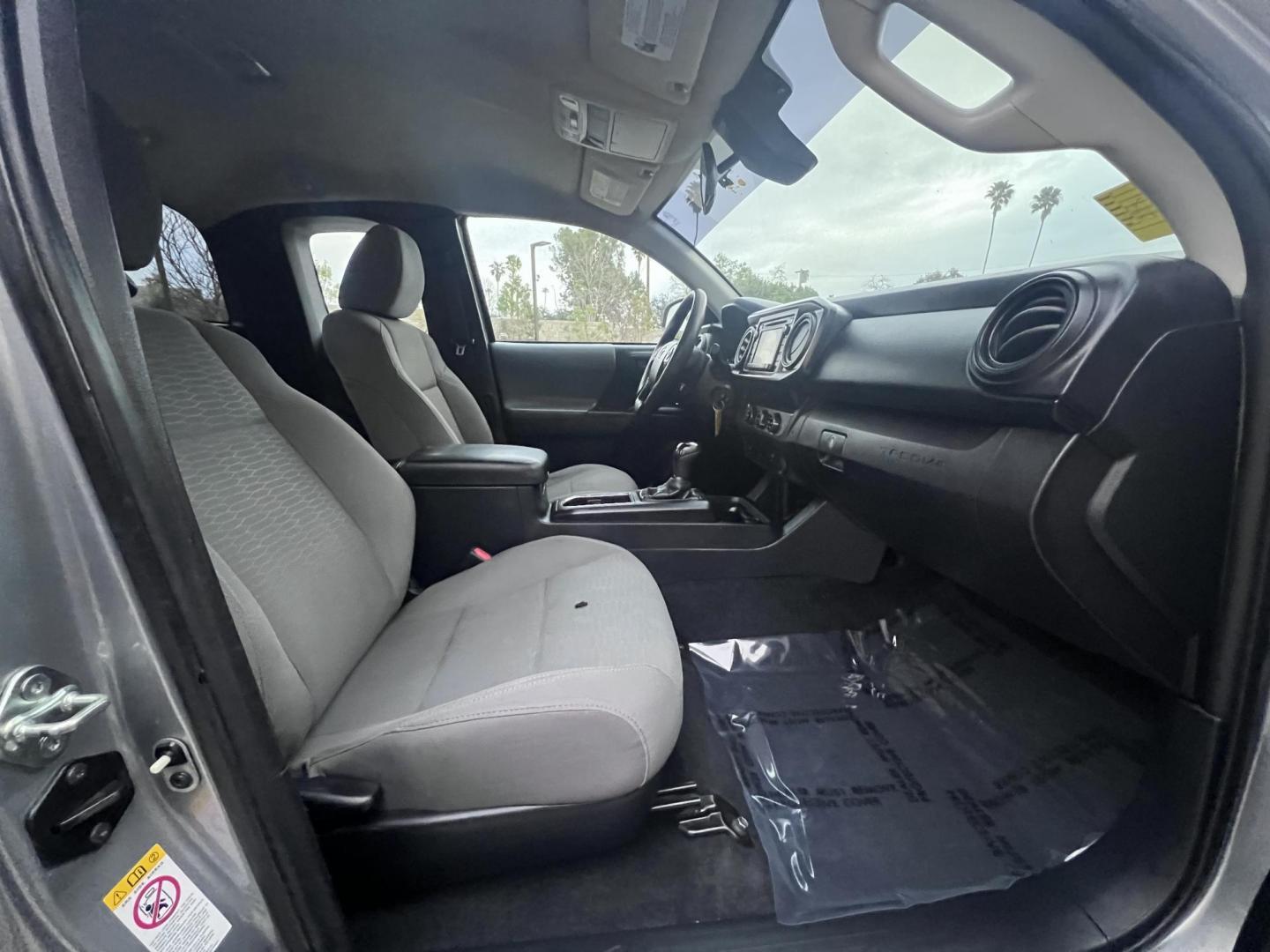 2018 Space Gray Metallic Toyota Tacoma SR5 Access Cab I4 6AT 2WD (5TFRX5GNXJX) with an 2.7L L4 DOHC 16V engine, 6A transmission, located at 30 S. Berkeley Avenue, Pasadena, CA, 91107, (626) 248-7567, 34.145447, -118.109398 - Crown City Motors is a used “Buy Here Pay Here” car dealer in Pasadena CA. “Buy Here Pay Here” financing, means that when you purchase your vehicle from our dealership, that you make the payments to the dealership as well. We do not need the banks approval to get you approved for a used auto - Photo#26