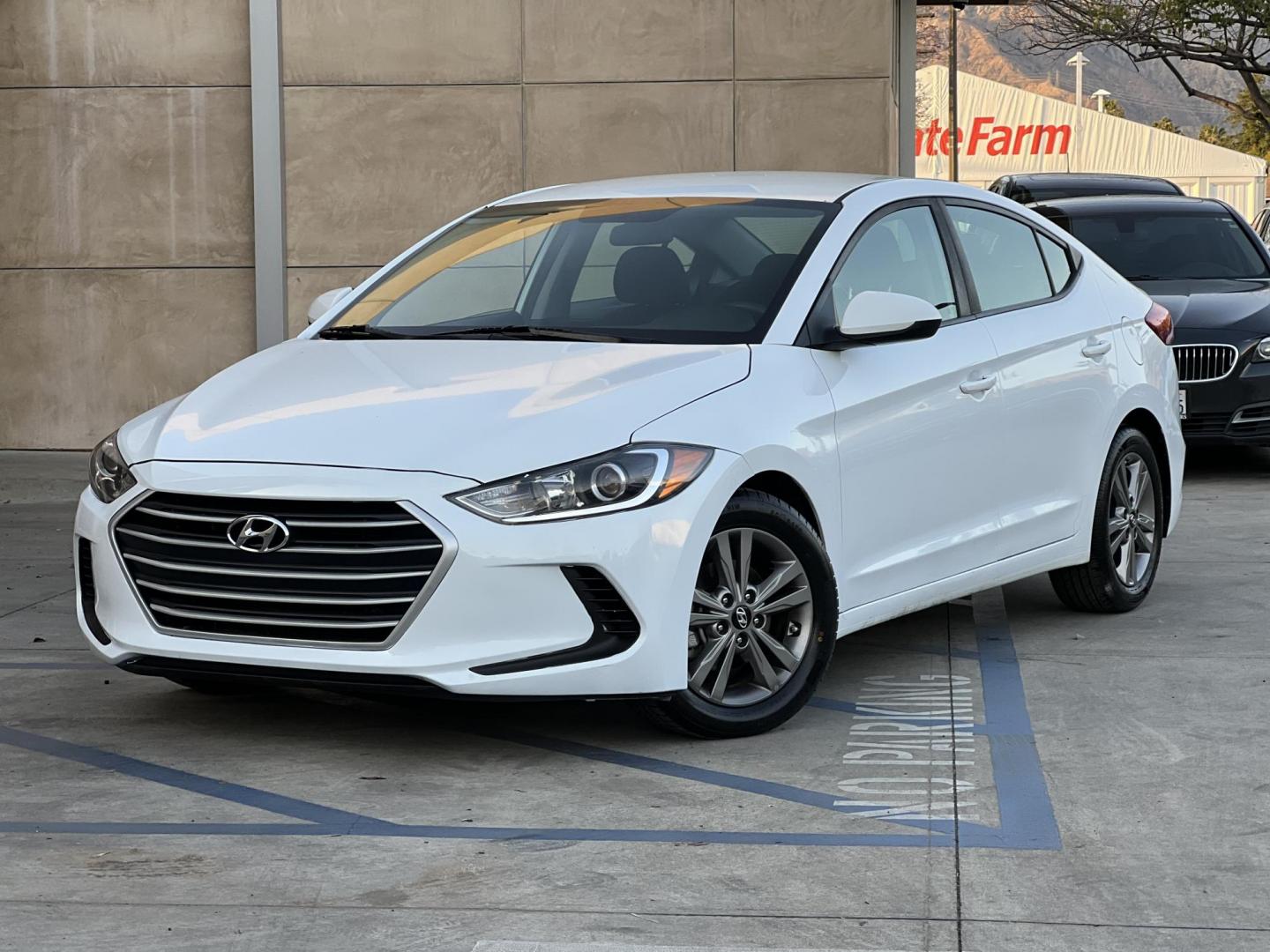 2018 White /BLACK Hyundai Elantra Limited (5NPD84LF3JH) with an 1.8L L4 DOHC 16V engine, 6A transmission, located at 30 S. Berkeley Avenue, Pasadena, CA, 91107, (626) 248-7567, 34.145447, -118.109398 - Looking for a reliable, affordable, and stylish sedan? Visit Crow City Motors at 30 S Berkeley Ave, Pasadena, CA 91107, and check out our 2018 Hyundai Elantra sedan. At Crow City Motors, we specialize in helping customers secure the vehicle they need with flexible financing options, including Buy He - Photo#0