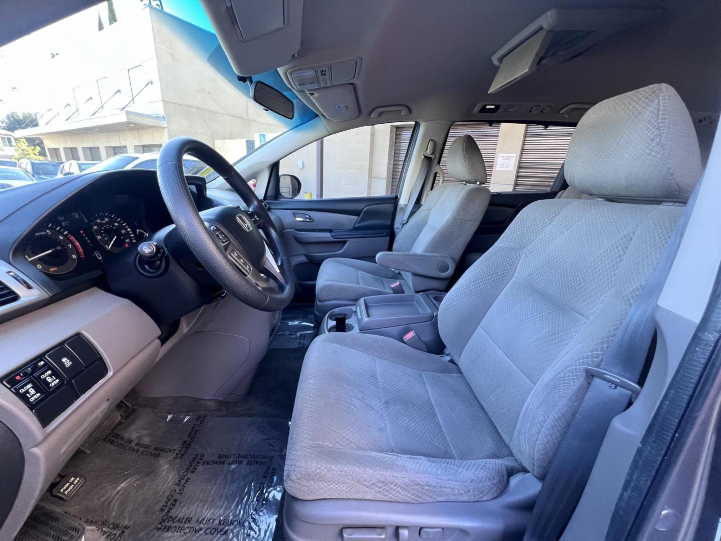 2016 Gray /Gray Honda Odyssey SE (5FNRL5H38GB) with an 3.5L V6 SOHC 24V engine, 6A transmission, located at 30 S. Berkeley Avenue, Pasadena, CA, 91107, (626) 248-7567, 34.145447, -118.109398 - For sale at Crown City Motors, 30 S Berkeley Ave, Pasadena, CA 91107: a reliable 2016 Honda Odyssey with rear AC, perfect for families needing a spacious 7-passenger minivan. This well-maintained vehicle offers a smooth ride, ample cargo space, and modern features to ensure comfort on every journey. - Photo#10