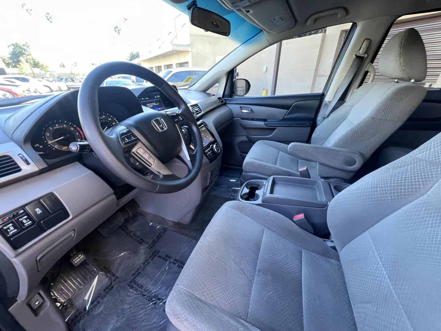 2016 Gray /Gray Honda Odyssey SE (5FNRL5H38GB) with an 3.5L V6 SOHC 24V engine, 6A transmission, located at 30 S. Berkeley Avenue, Pasadena, CA, 91107, (626) 248-7567, 34.145447, -118.109398 - For sale at Crown City Motors, 30 S Berkeley Ave, Pasadena, CA 91107: a reliable 2016 Honda Odyssey with rear AC, perfect for families needing a spacious 7-passenger minivan. This well-maintained vehicle offers a smooth ride, ample cargo space, and modern features to ensure comfort on every journey. - Photo#15