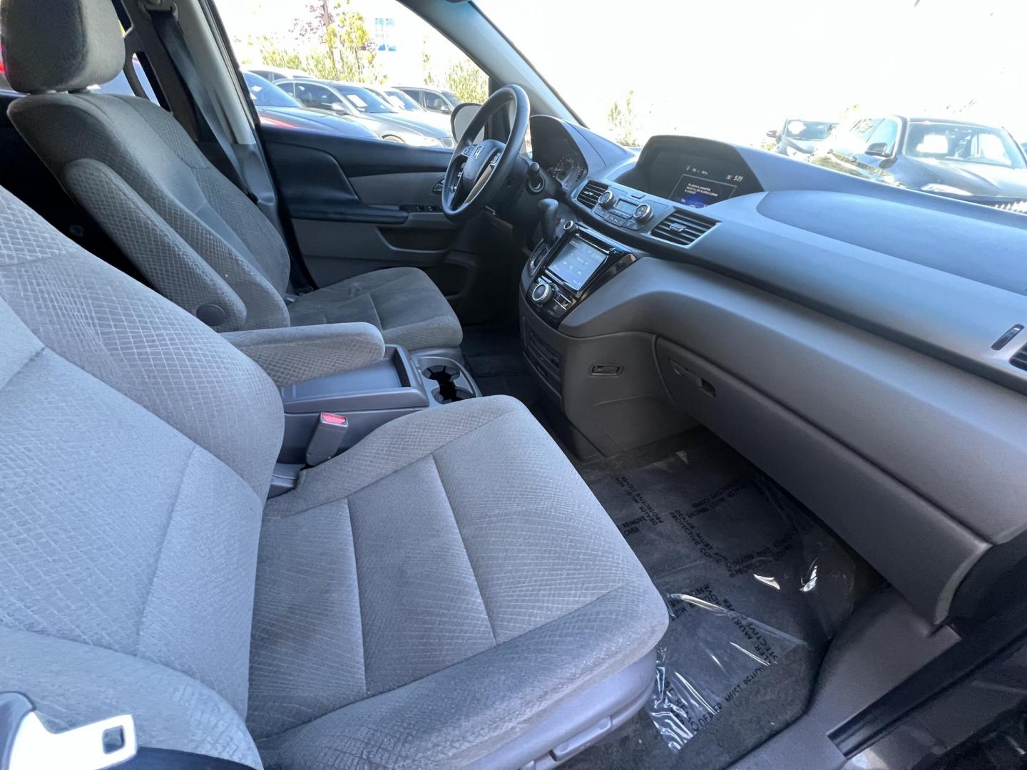 2016 Gray /Gray Honda Odyssey SE (5FNRL5H38GB) with an 3.5L V6 SOHC 24V engine, 6A transmission, located at 30 S. Berkeley Avenue, Pasadena, CA, 91107, (626) 248-7567, 34.145447, -118.109398 - For sale at Crown City Motors, 30 S Berkeley Ave, Pasadena, CA 91107: a reliable 2016 Honda Odyssey with rear AC, perfect for families needing a spacious 7-passenger minivan. This well-maintained vehicle offers a smooth ride, ample cargo space, and modern features to ensure comfort on every journey. - Photo#24