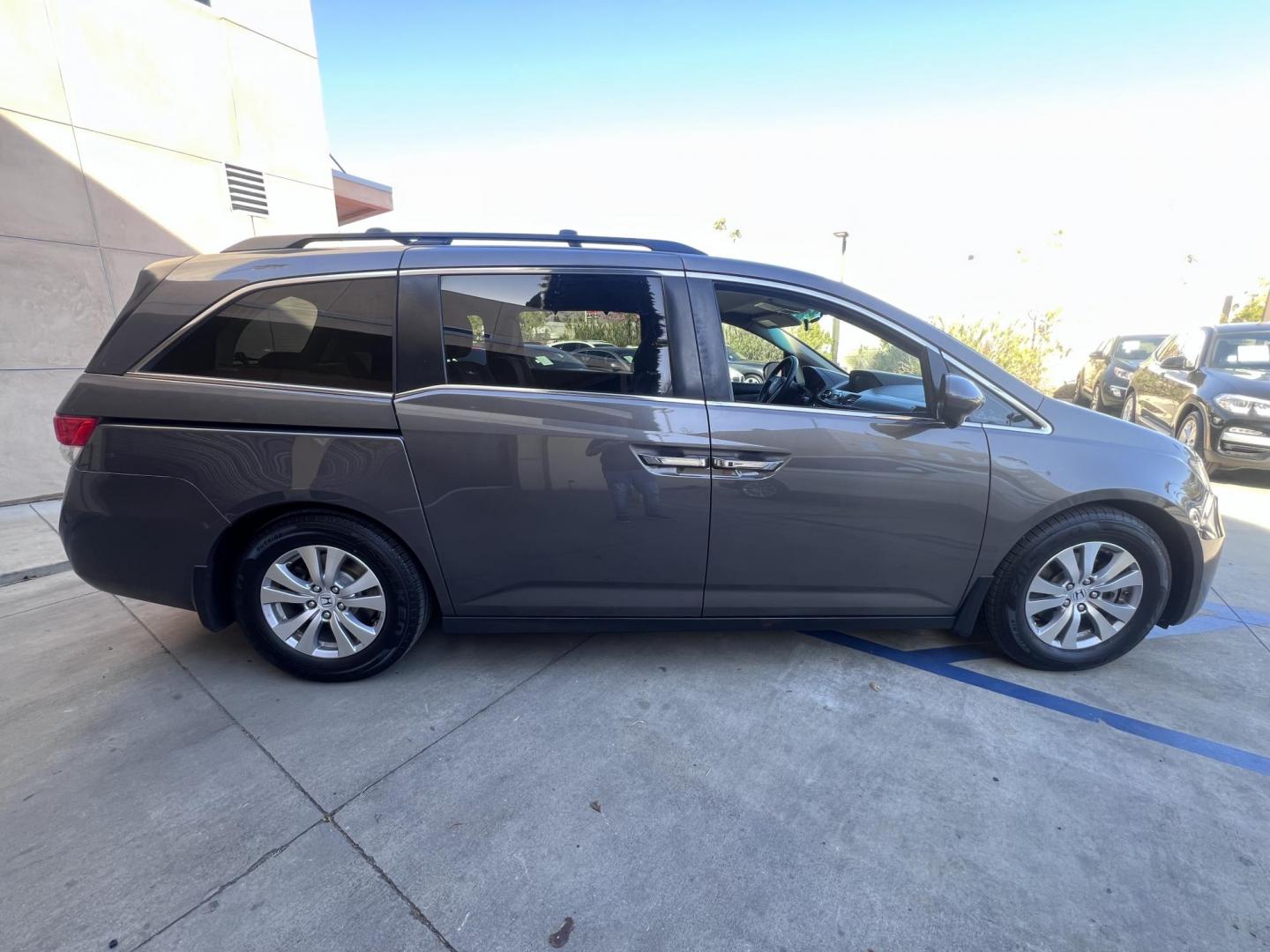 2016 Gray /Gray Honda Odyssey SE (5FNRL5H38GB) with an 3.5L V6 SOHC 24V engine, 6A transmission, located at 30 S. Berkeley Avenue, Pasadena, CA, 91107, (626) 248-7567, 34.145447, -118.109398 - For sale at Crown City Motors, 30 S Berkeley Ave, Pasadena, CA 91107: a reliable 2016 Honda Odyssey with rear AC, perfect for families needing a spacious 7-passenger minivan. This well-maintained vehicle offers a smooth ride, ample cargo space, and modern features to ensure comfort on every journey. - Photo#9