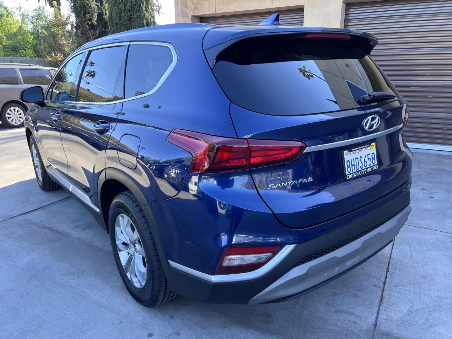 2019 Stormy BLue /Black Hyundai Santa Fe SEL 2.4 (5NMS33AD0KH) with an 2.4L L4 DOHC 16V engine, 8A transmission, located at 30 S. Berkeley Avenue, Pasadena, CA, 91107, (626) 248-7567, 34.145447, -118.109398 - Are you in the market for a stylish, reliable, and family-friendly SUV? Look no further than this 2019 Hyundai Santa Fe, available now at Crown City Motors, located at 30 S Berkeley Ave, Pasadena, CA 91107. As a premier Buy Here Pay Here dealership in Pasadena, we’re proud to offer this exceptiona - Photo#13