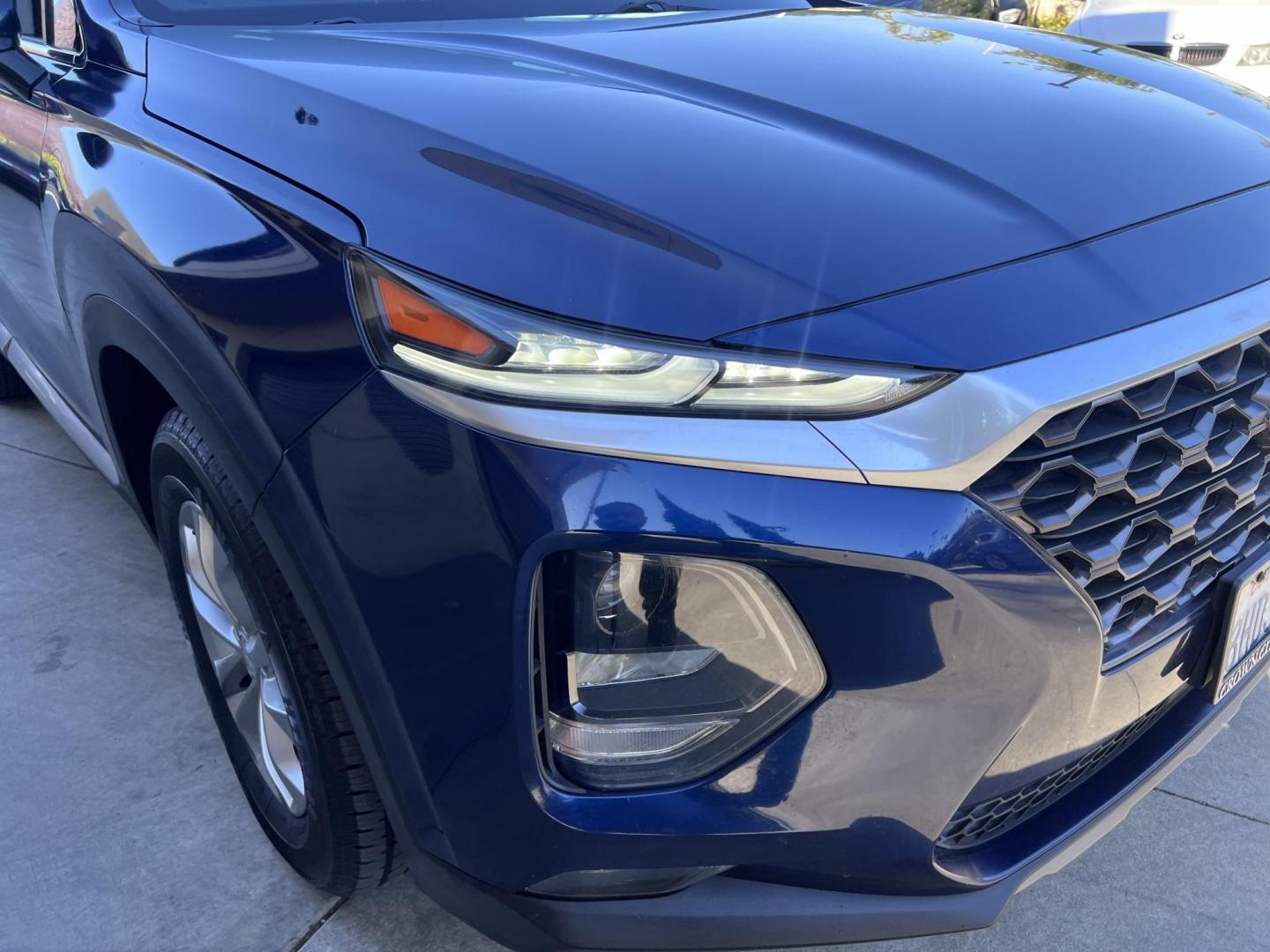 2019 Stormy BLue /Black Hyundai Santa Fe SEL 2.4 (5NMS33AD0KH) with an 2.4L L4 DOHC 16V engine, 8A transmission, located at 30 S. Berkeley Avenue, Pasadena, CA, 91107, (626) 248-7567, 34.145447, -118.109398 - Are you in the market for a stylish, reliable, and family-friendly SUV? Look no further than this 2019 Hyundai Santa Fe, available now at Crown City Motors, located at 30 S Berkeley Ave, Pasadena, CA 91107. As a premier Buy Here Pay Here dealership in Pasadena, we’re proud to offer this exceptiona - Photo#14