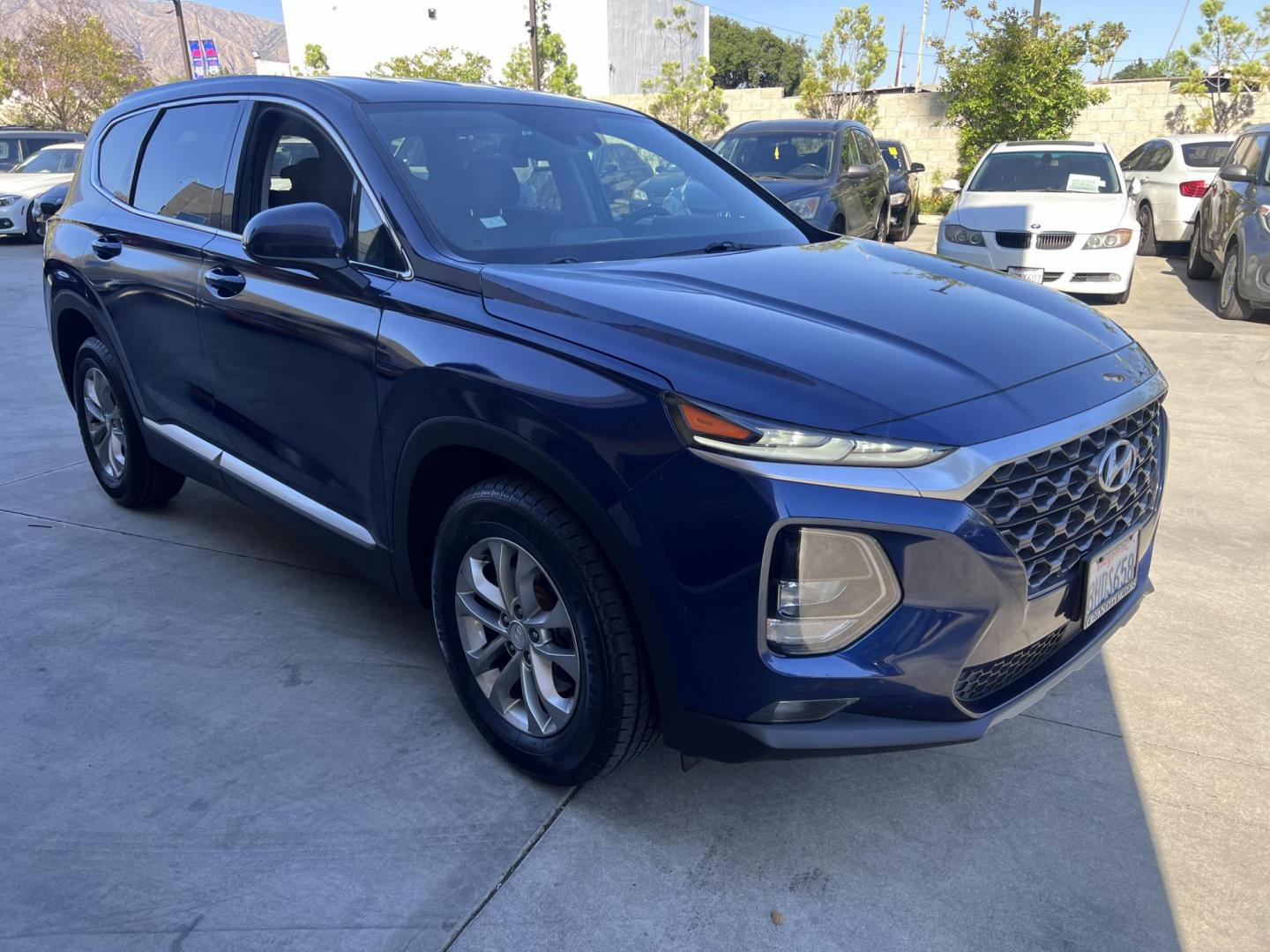 2019 Stormy BLue /Black Hyundai Santa Fe SEL 2.4 (5NMS33AD0KH) with an 2.4L L4 DOHC 16V engine, 8A transmission, located at 30 S. Berkeley Avenue, Pasadena, CA, 91107, (626) 248-7567, 34.145447, -118.109398 - Are you in the market for a stylish, reliable, and family-friendly SUV? Look no further than this 2019 Hyundai Santa Fe, available now at Crown City Motors, located at 30 S Berkeley Ave, Pasadena, CA 91107. As a premier Buy Here Pay Here dealership in Pasadena, we’re proud to offer this exceptiona - Photo#15