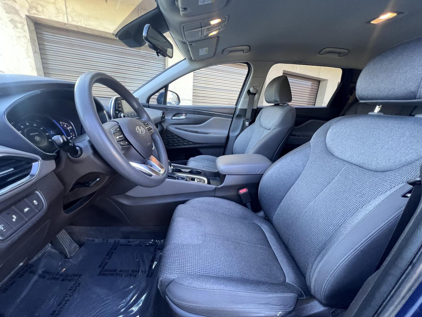 2019 Stormy BLue /Black Hyundai Santa Fe SEL 2.4 (5NMS33AD0KH) with an 2.4L L4 DOHC 16V engine, 8A transmission, located at 30 S. Berkeley Avenue, Pasadena, CA, 91107, (626) 248-7567, 34.145447, -118.109398 - Are you in the market for a stylish, reliable, and family-friendly SUV? Look no further than this 2019 Hyundai Santa Fe, available now at Crown City Motors, located at 30 S Berkeley Ave, Pasadena, CA 91107. As a premier Buy Here Pay Here dealership in Pasadena, we’re proud to offer this exceptiona - Photo#22
